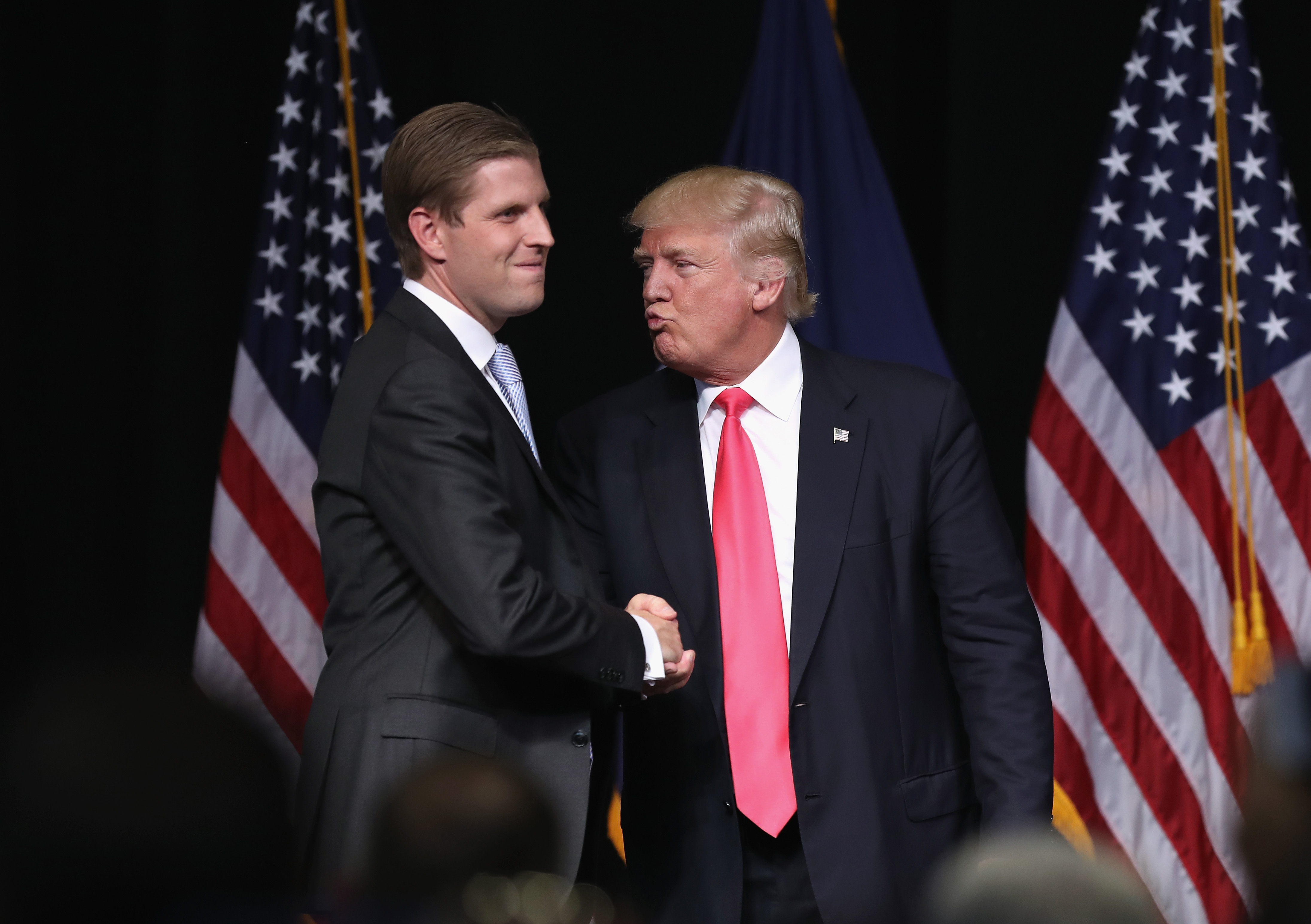 Republican Presidential candidate Donald Trump gives an "air kiss" to his son Eric Trump at a campaign rally in Scranton, Penn., on July 27, 2016.