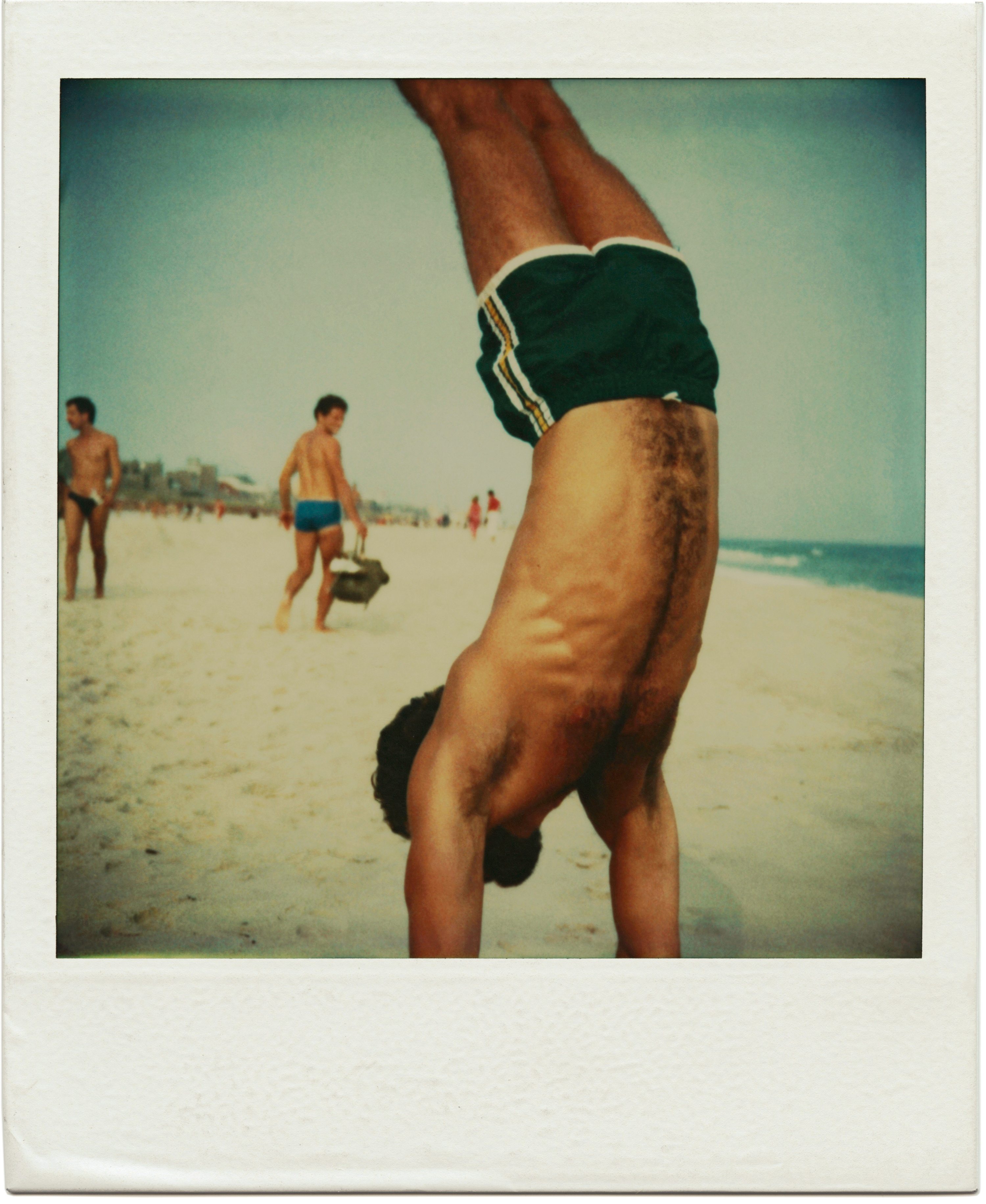 Untitled, 368
                              from the series Fire Island Pines, Polaroids 1975-1983.
                              
                               As a figurative photographer, [the beach] is one of the most natural places for me to make my art. [This photo] expresses the reason why we all love to come to the beach to play.”