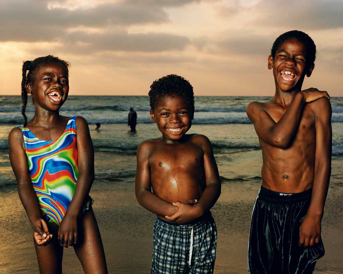 Abir, Munir, And Sullman Jaffa, 2002. From Testimony Series."When I made this photo in 2002 it felt like the beach is where the country came to escape the daily turmoil. This remains one of my favorite images I made at the beach because of the unbridled joy these children exude. A day before I made this image, a suicide bomber killed and injured many people. The innocence and rapture here makes me momentarily forget the reality of what happened down the road."