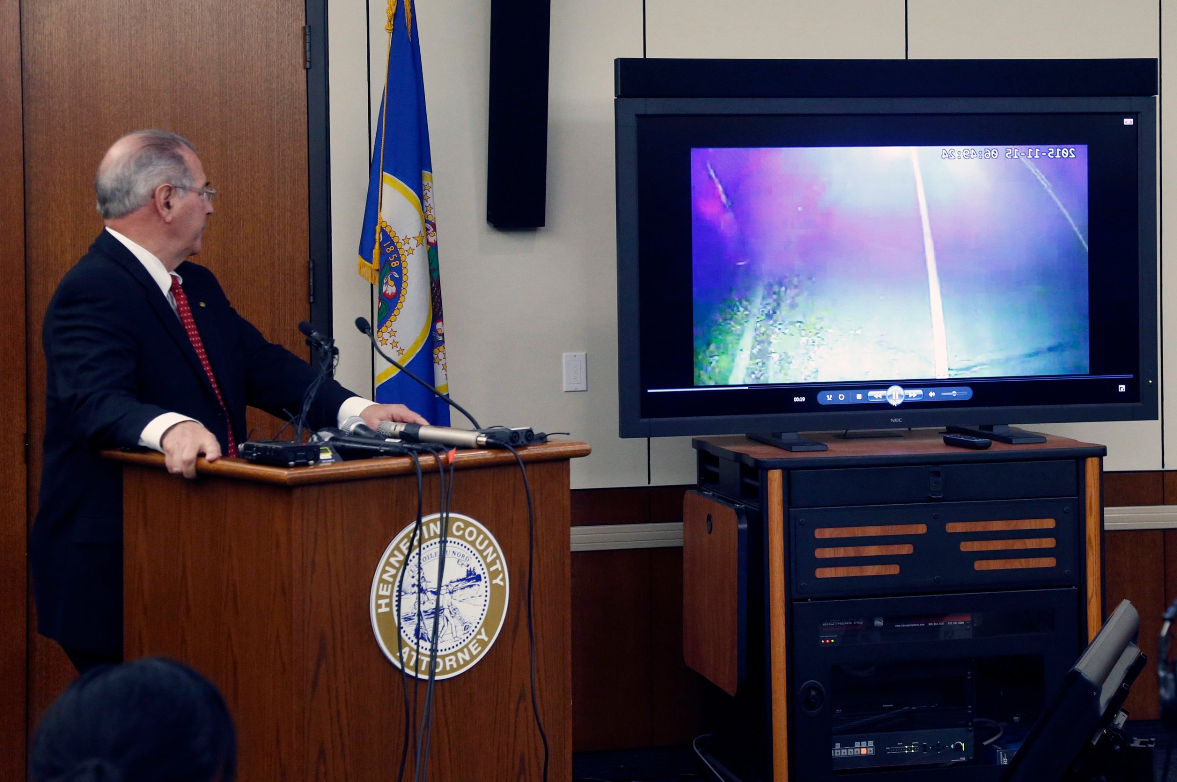County Attorney Mike Freeman, shows video from evidence after he announced in Minneapolis on March 30, 2016.