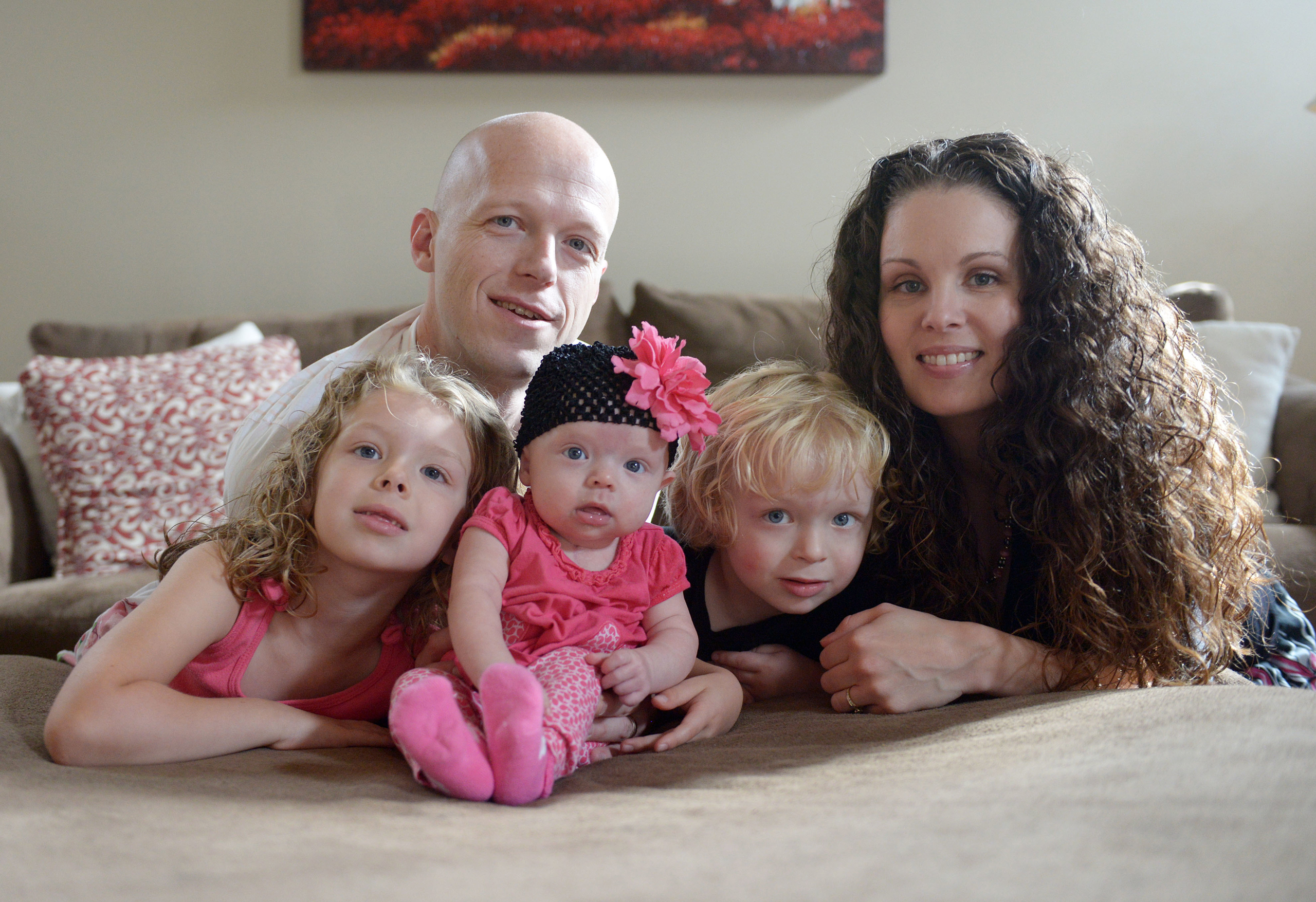 Willow Short, 4-month-old, center, along with her parents Megan and Mark and sister Liana, 6, and brother Mark, 3, poses for a photo in Sinking Spring, Pa. on Sept. 1, 2014. (Susan L. Angstadt—Reading Eagle/AP)