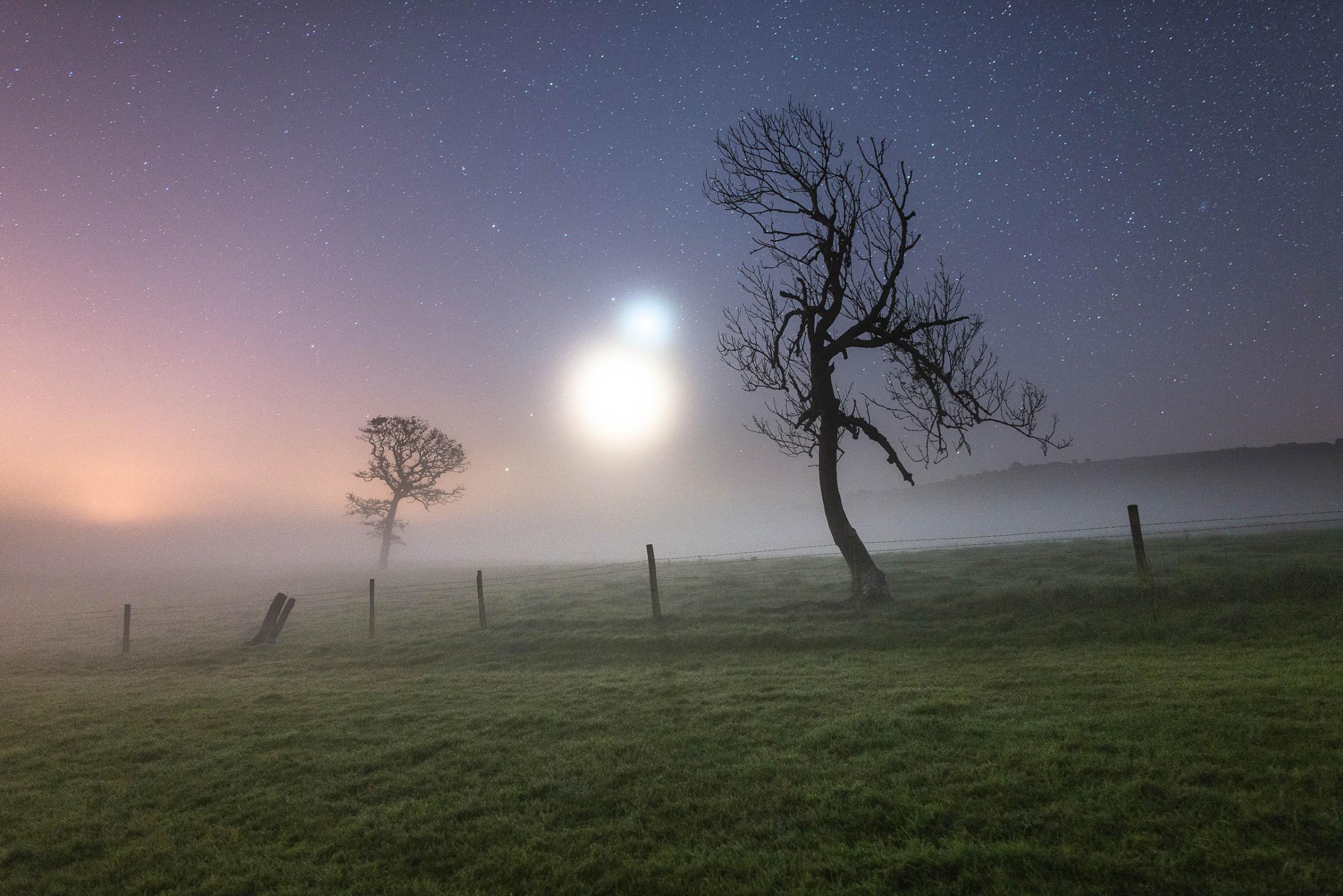 Skyscapes:Ainsley Bennet captured this image of Venus and the crescent Moon on a misty morning on the Isle of Wight in October. The image "looked like something from a science fiction movie, with Binary stars rising from the horizon of an unknown planet," he writes.