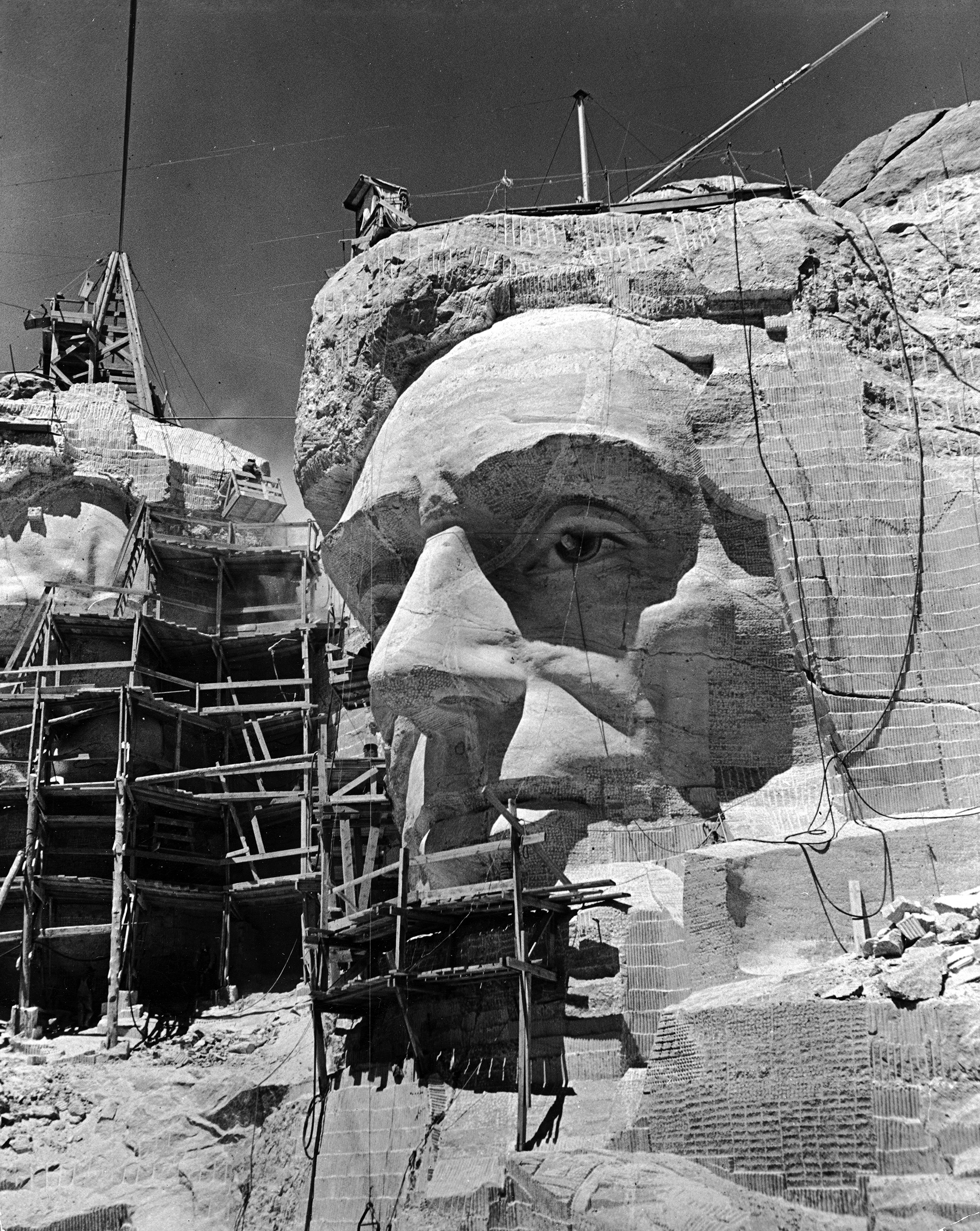 Scaffolding around head of Abraham Lincoln only partially sculptured during Mount Rushmore Monument construction, circa 1941.