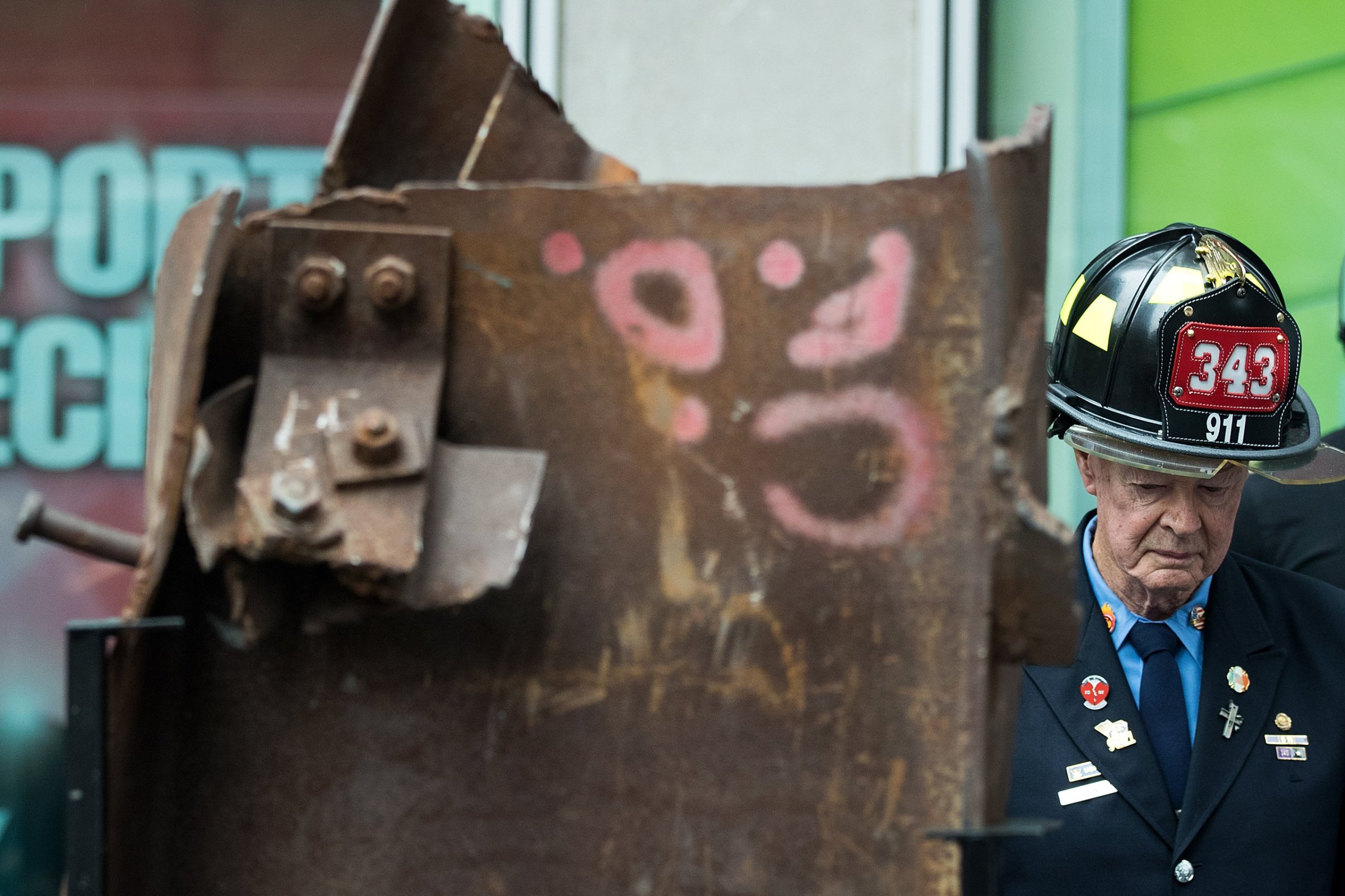 Bob Beckwith, retired firefighter who stood next to President George W. Bush at ground zero, stands next to a piece of steel from the World Trade Center, during a ceremony outside the Fox News studios to mark the beginning of the piece of steel's journey from New York City to Gander, Newfoundland in Canada, in New York City on Sept. 6, 2016.