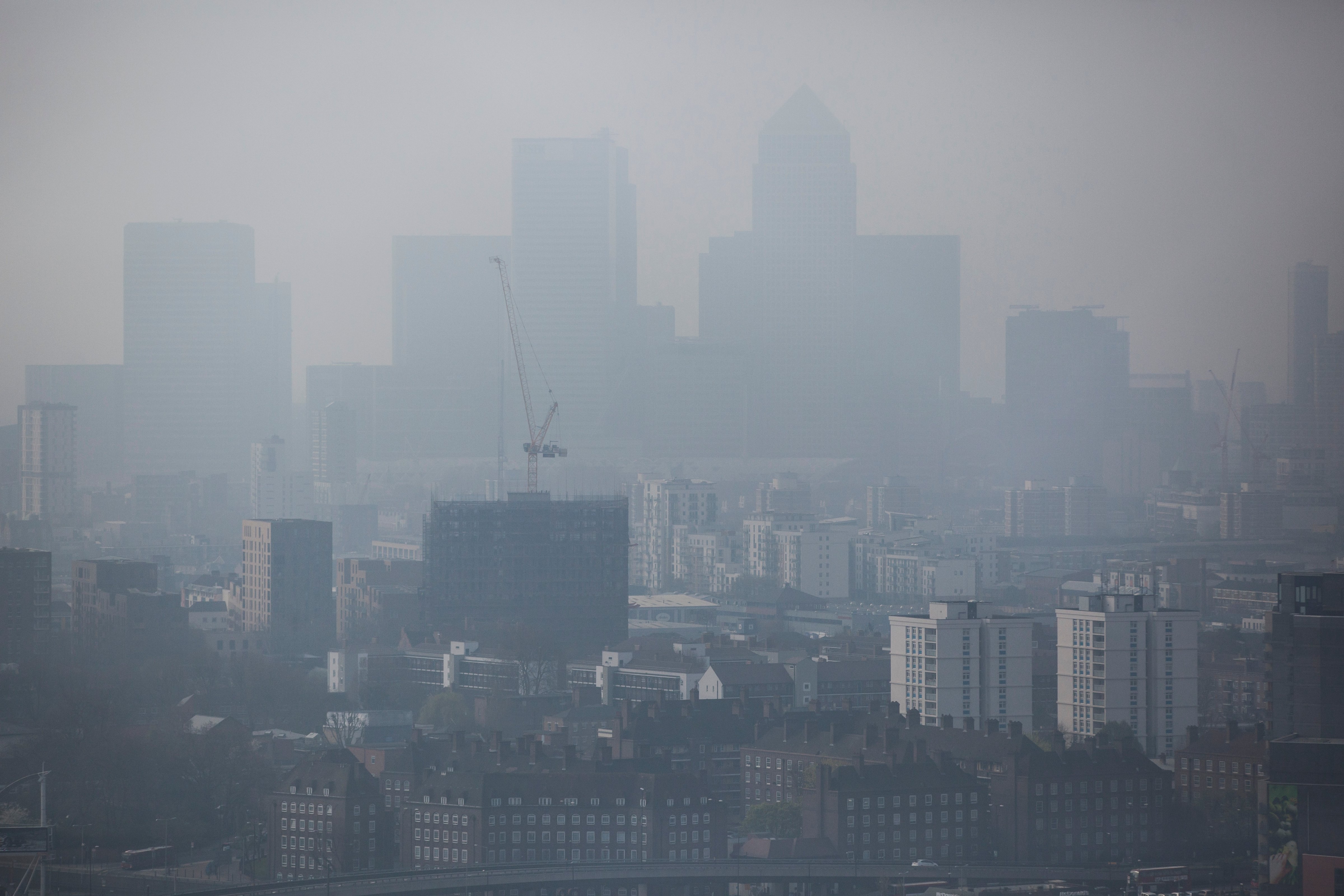 A general view through smog of the Canary Wharf financial district on April 2, 2014 in London, England. (Dan Kitwood—Getty Images)