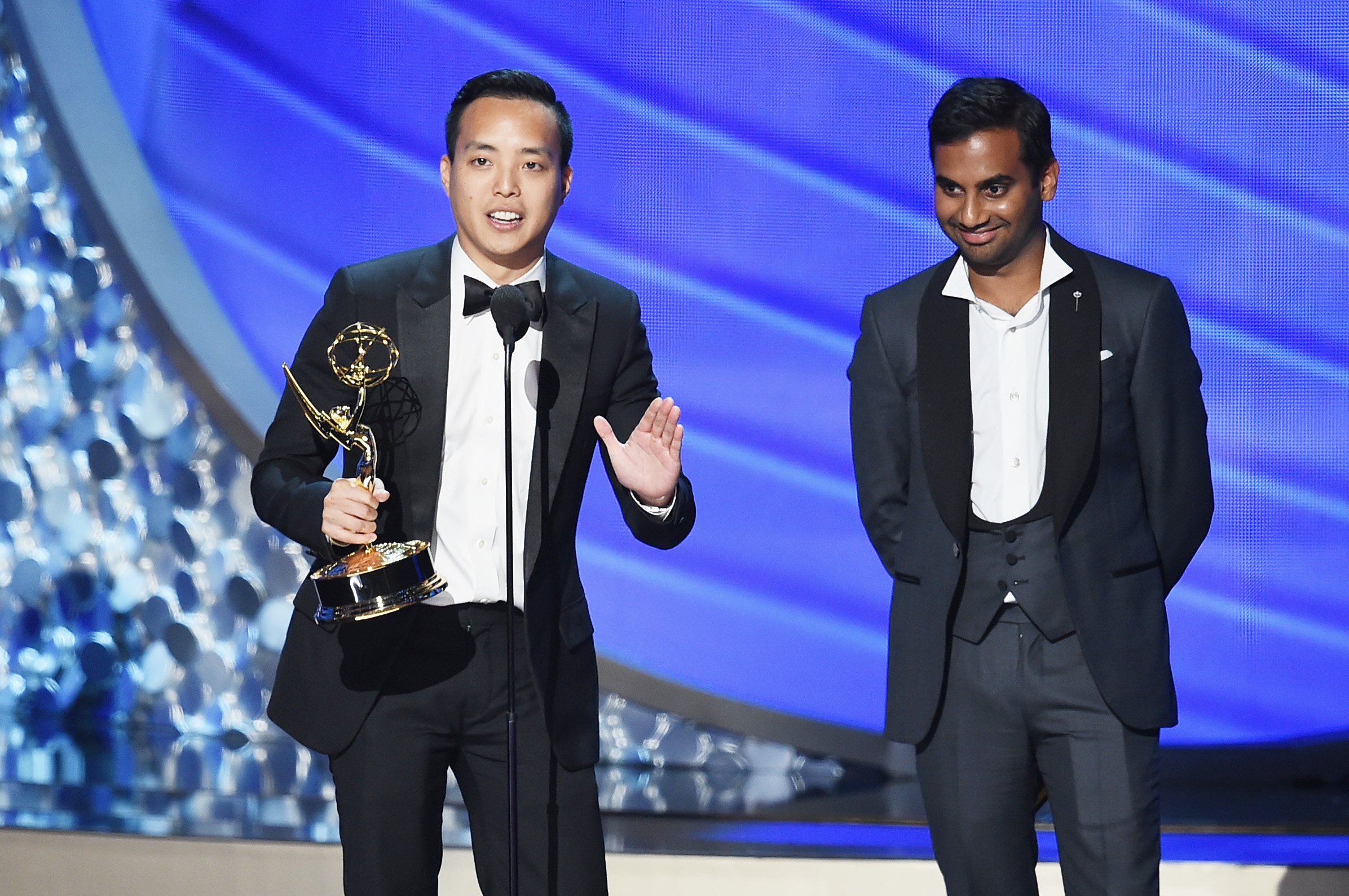 Alan Yang, left, and Aziz Ansari accept Outstanding Writing for a Comedy Series for the <i>Master of None</I> episode 