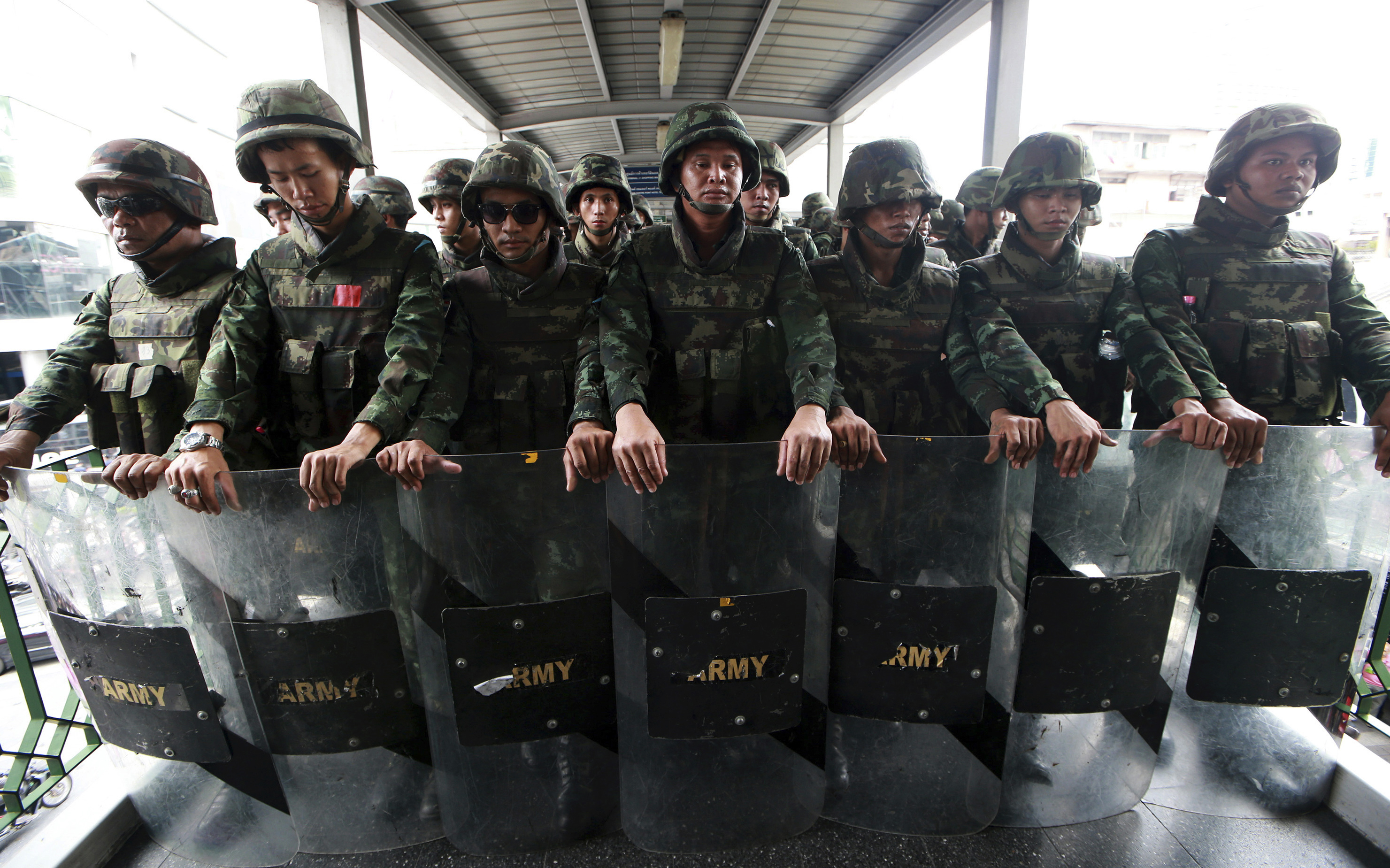 Thai soldiers guard an overpass to prevent anti-coup demonstration in Bangkok on June 1, 2014 (Wason Wanichakorn—AP)