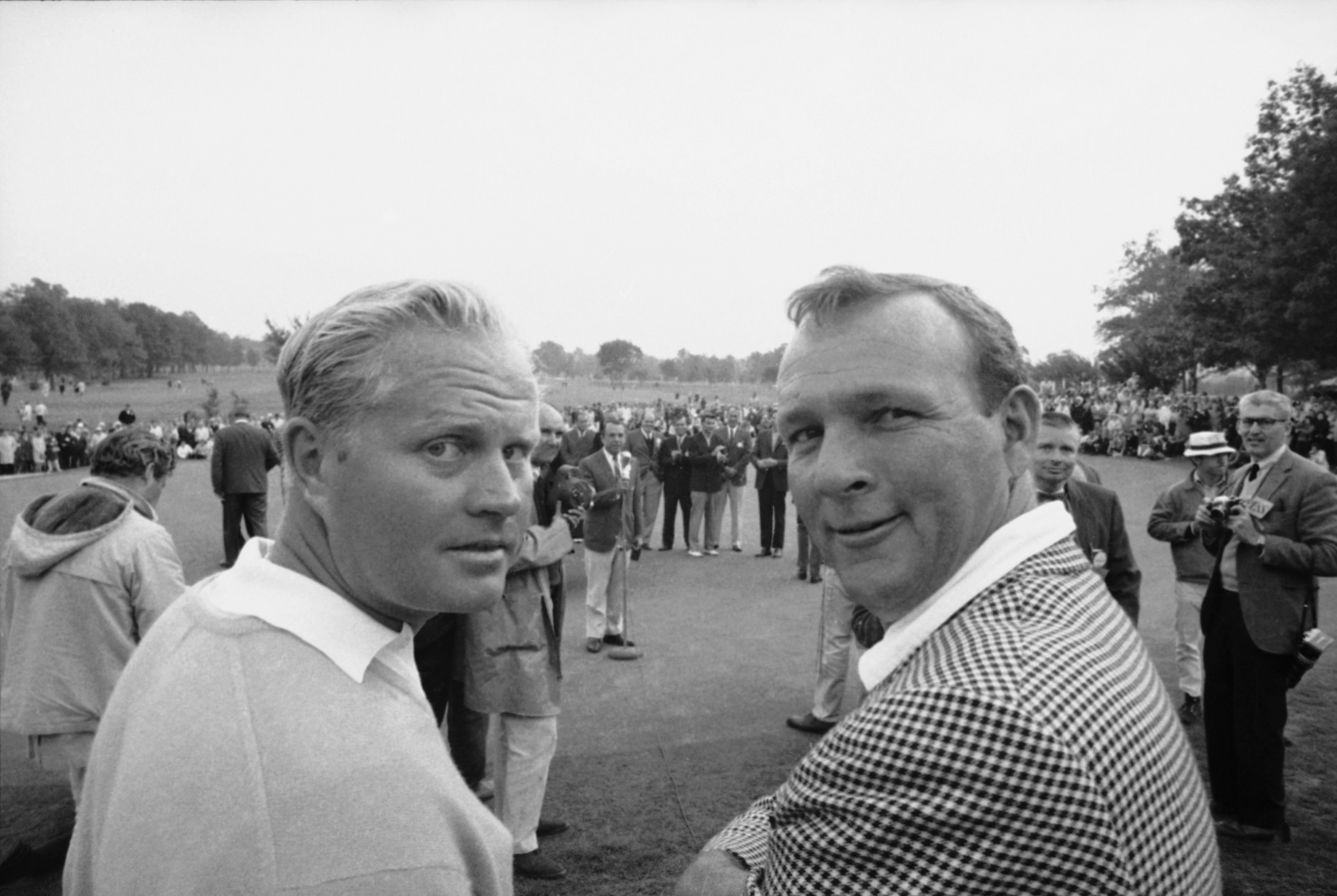 Thunderbird Golf Classic winner Arnold Palmer, right, and runner-up Jack Nicklaus stop for a backward look at photographers before meeting the rest of the press after the tournament in Clifton, N.J., on Sept. 25, 1967.
