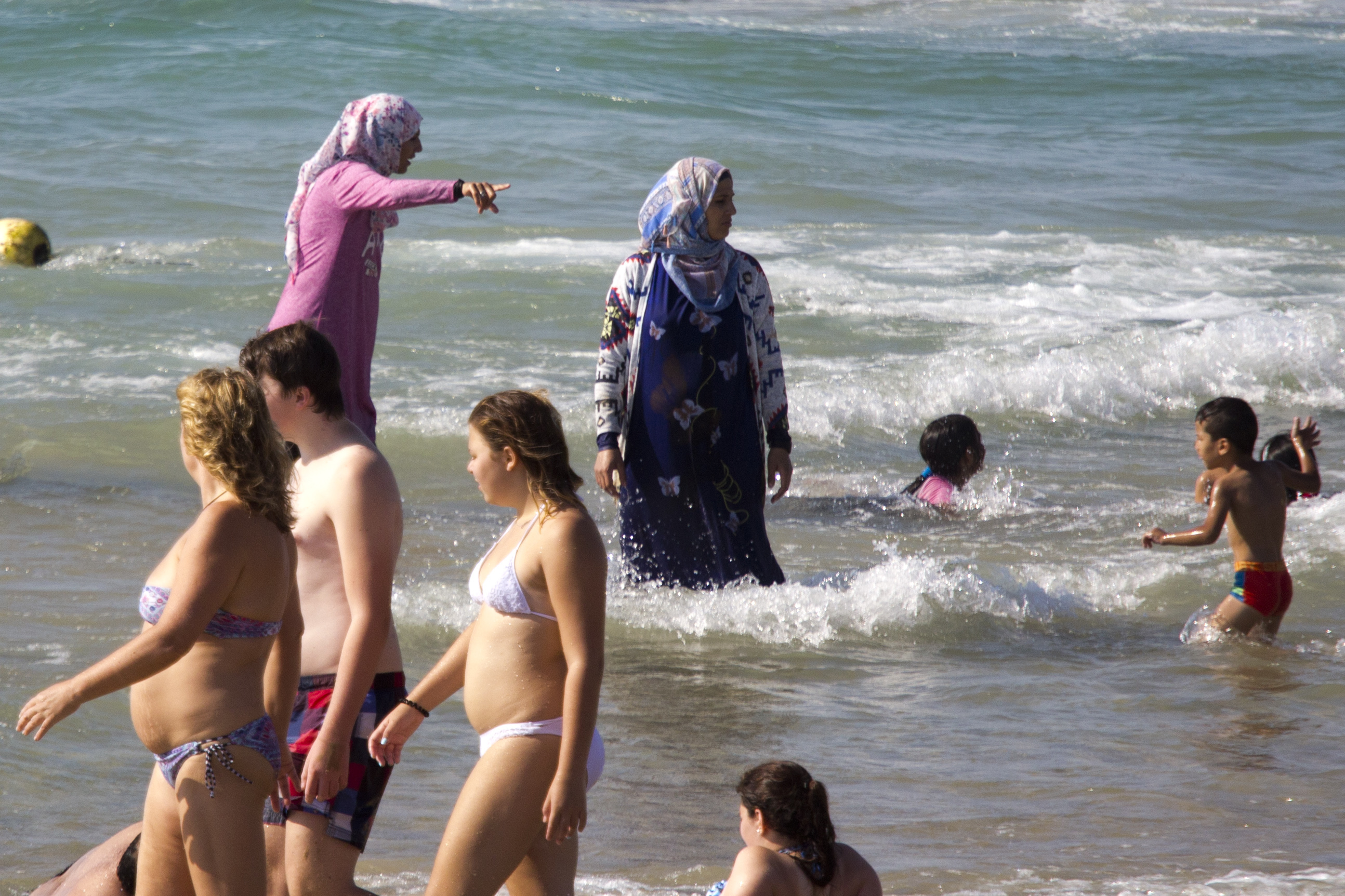 Muslim women bathe in the Mediterranean sea in Tel Aviv, Israel. on Sept. 2, 2016. (Ariel Schalit—AP)