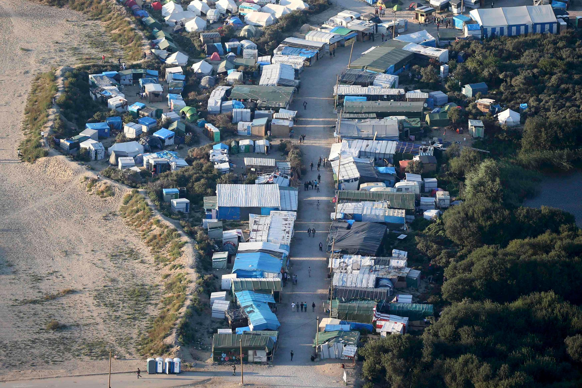 An aerial view shows makeshift shelters and tents where migrants live in what is known as "the Jungle," a sprawling camp in Calais, France, on Sept. 7, 2016.