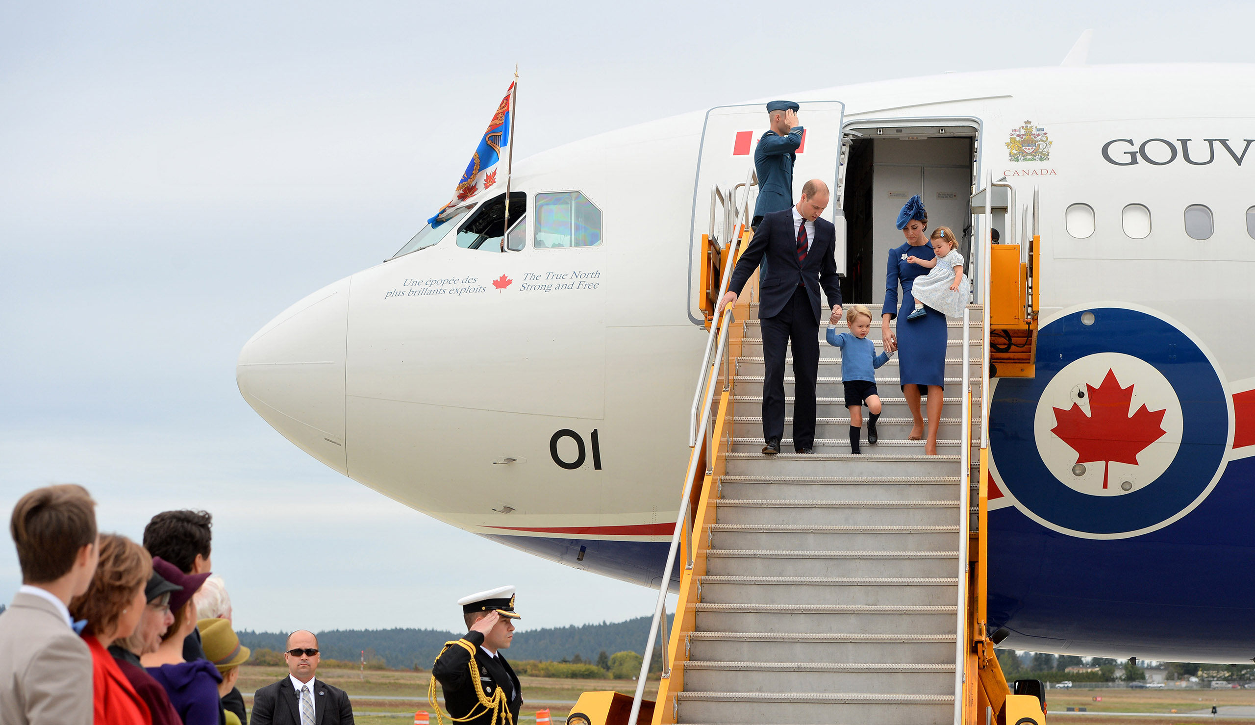 The Prime Minister of Canada Justin Trudeau and his wife Sophie, watch as Prince William, Duke of Cambridge, Catherine, Duchess of Cambridge, Prince George of Cambridge and Princess Charlotte of Cambridge arrive at Victoria International Airport on Sept. 24, 2016.