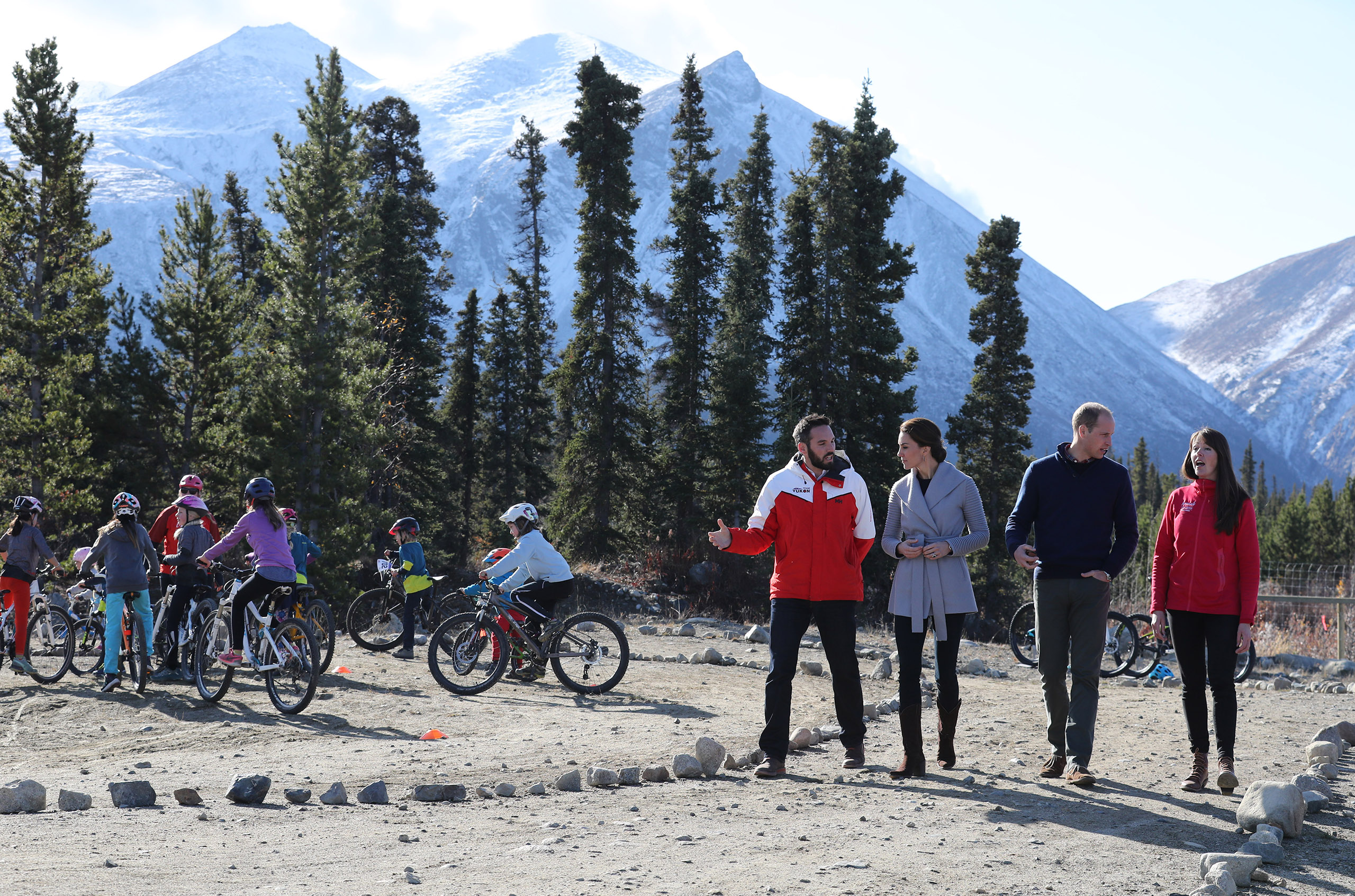 Catherine, Duchess of Cambridge, and Prince William, Duke of Cambridge, talk to locals about mountain bikes on Montana mountain near Carcross during the Royal Tour of Canada on Sept. 28, 2016.