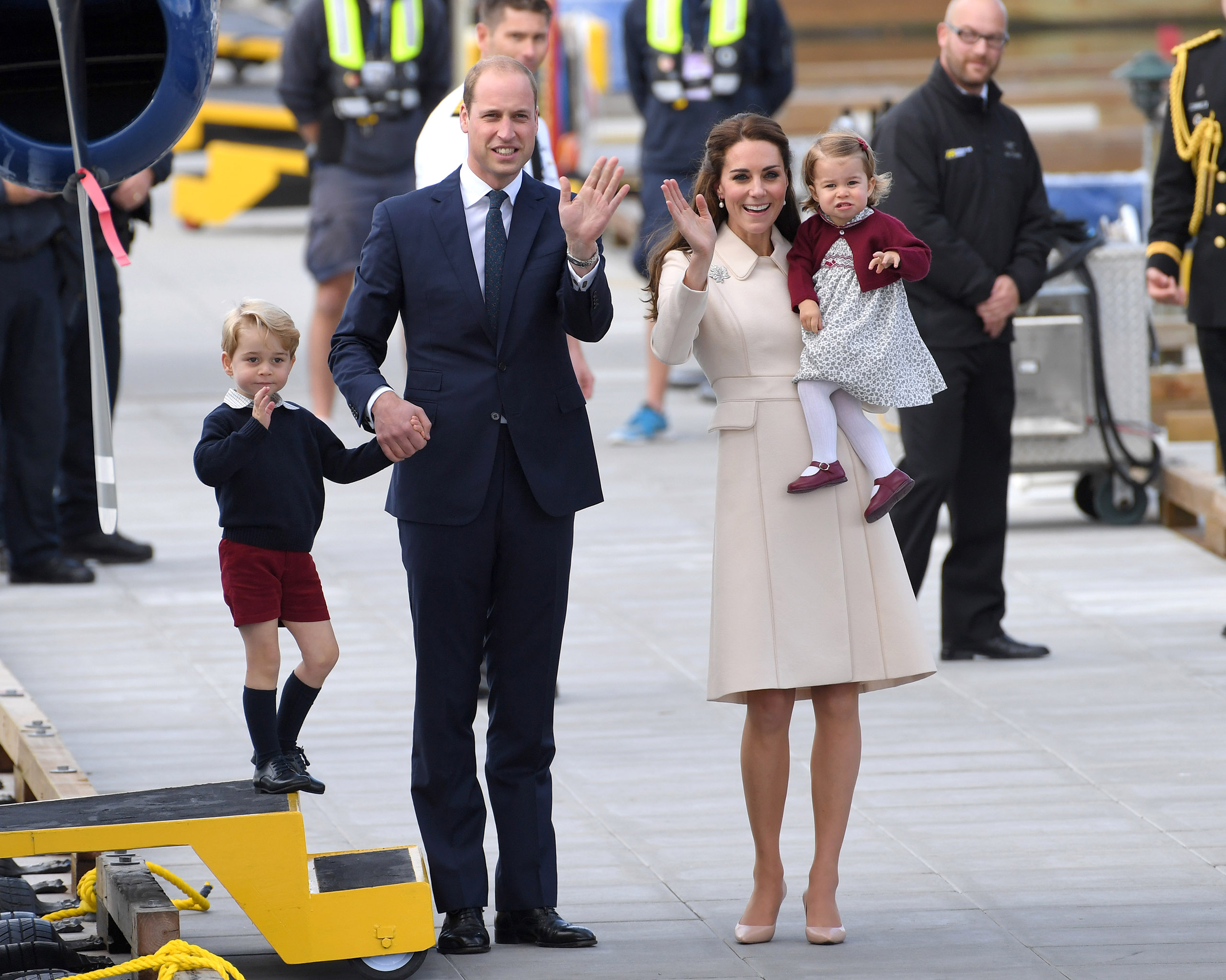 Catherine, Duchess of Cambridge, Prince William, Duke of Cambridge, Prince George and Princess Charlotte wave to well-wishers as they depart Victoria after their Royal Tour of Canada on Oct. 1, 2016.