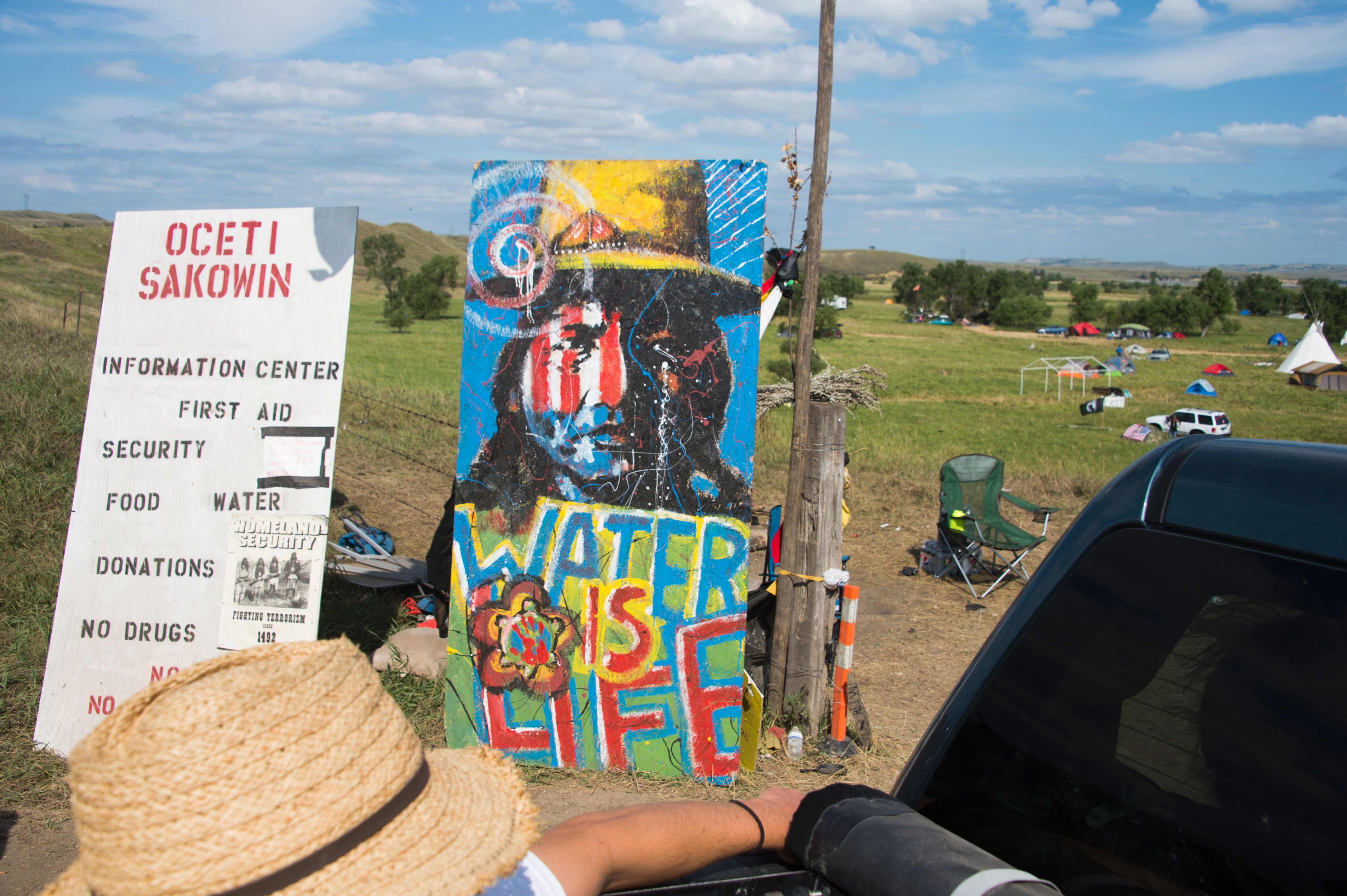 A sign welcomes visitors at the entrance to an oil pipeline protest encampment near Cannon Ball, N.D. (Robyn Beck—AFP/Getty Images)