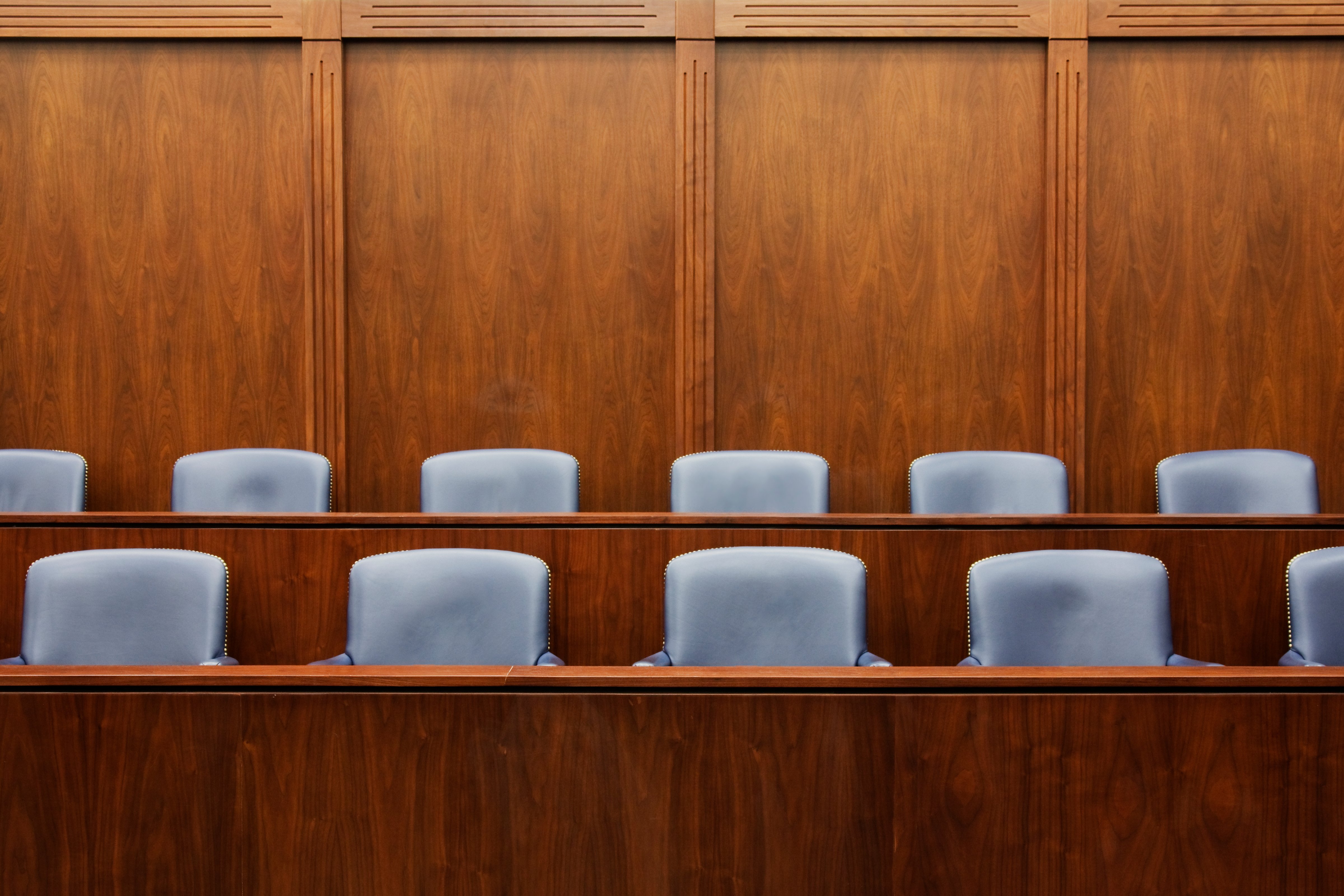 Empty Jury Seats in Courtroom (Spaces Images—Getty Images/Blend Images RM)