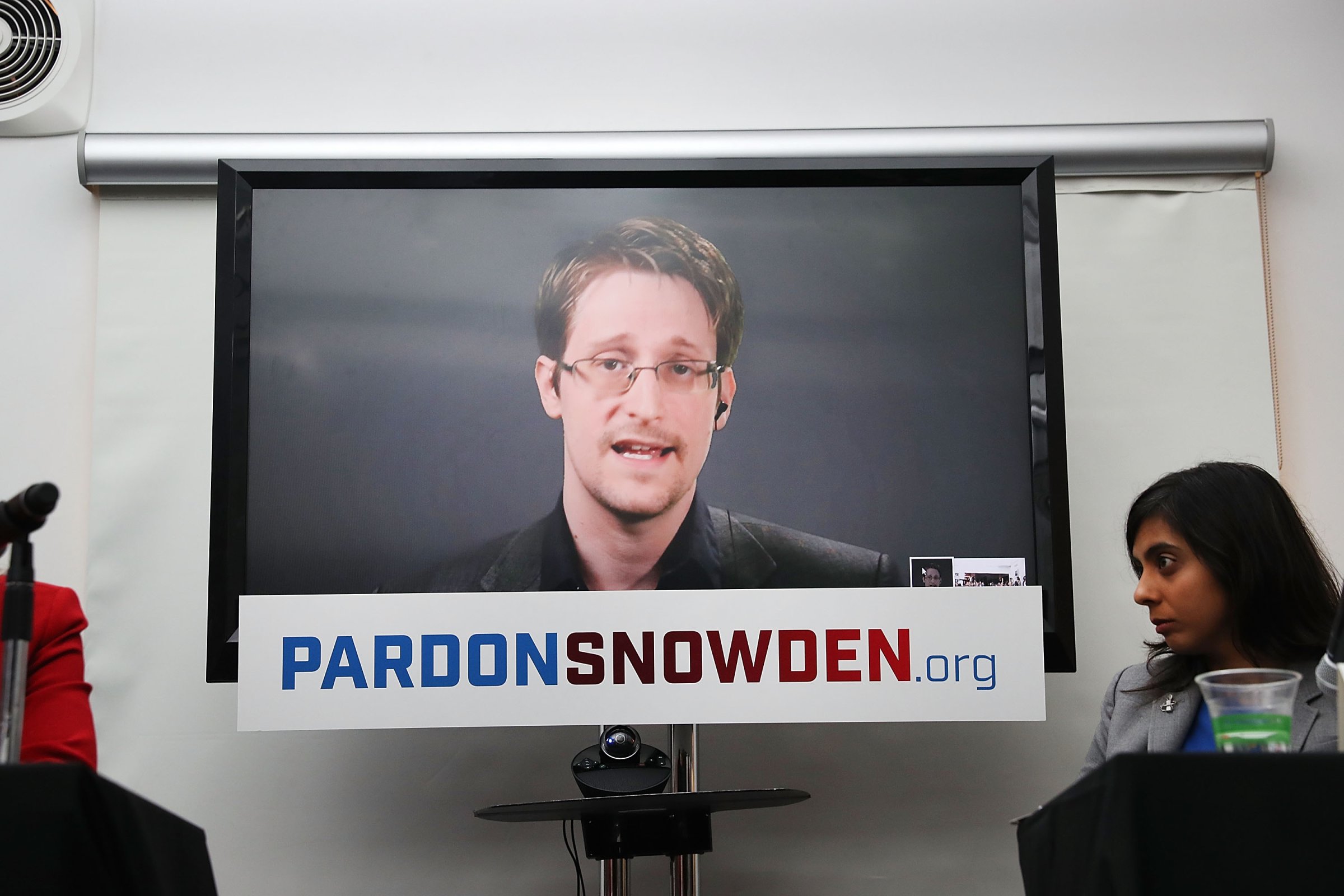 Edward Snowden speaks via video link at a news conference for the launch of a campaign calling for President Obama to pardon him in New York City on Sept. 14, 2016.