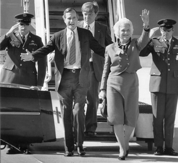 George H.W. Bush and wife, Barbara, arrive at Meacham Airport in Fort Worth, Texas, on November 5, 1984.