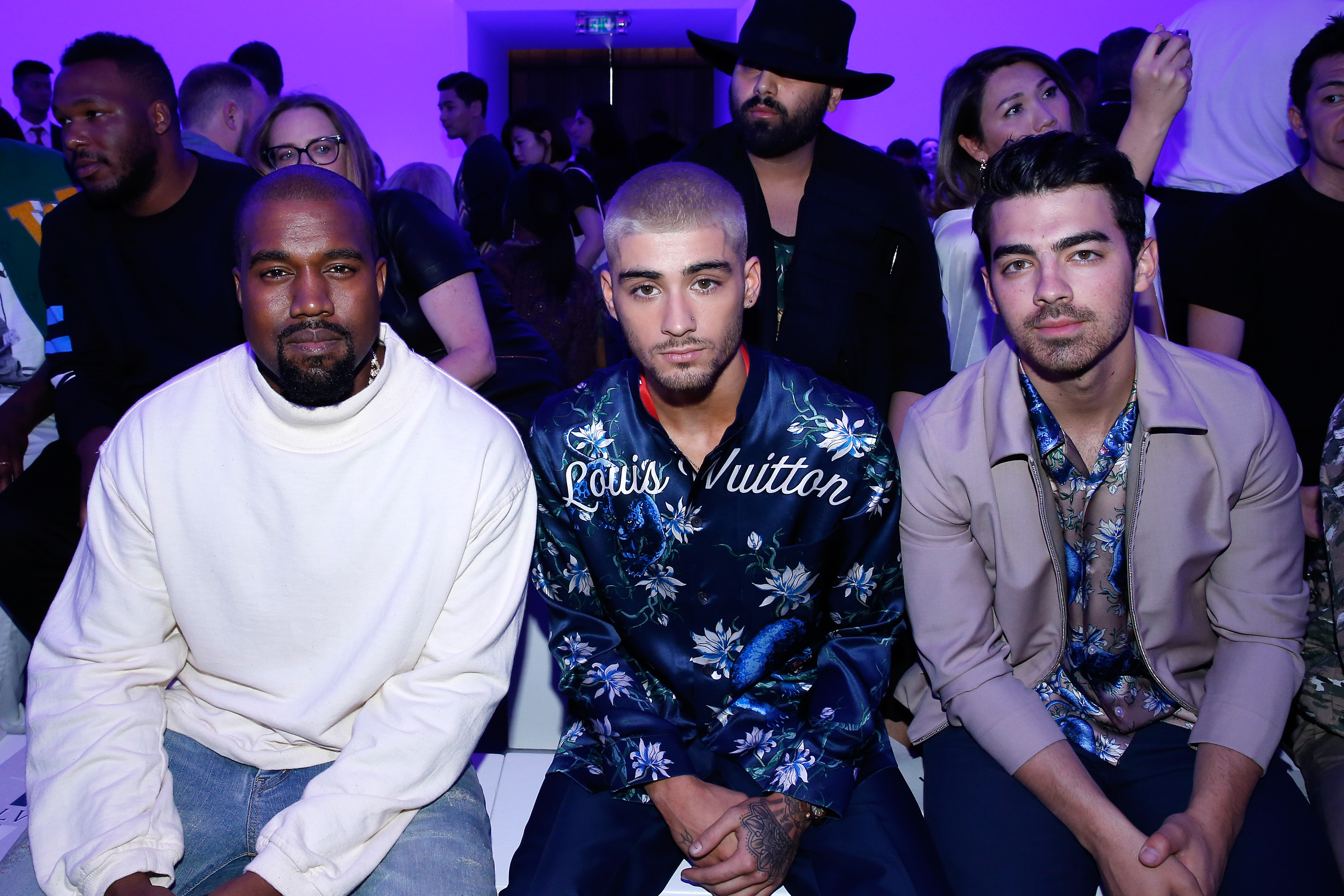 Kanye West, Zayn Malik and Joe Jonas attend the Louis Vuitton Spring/Summer 2016 Menswear fashion show.