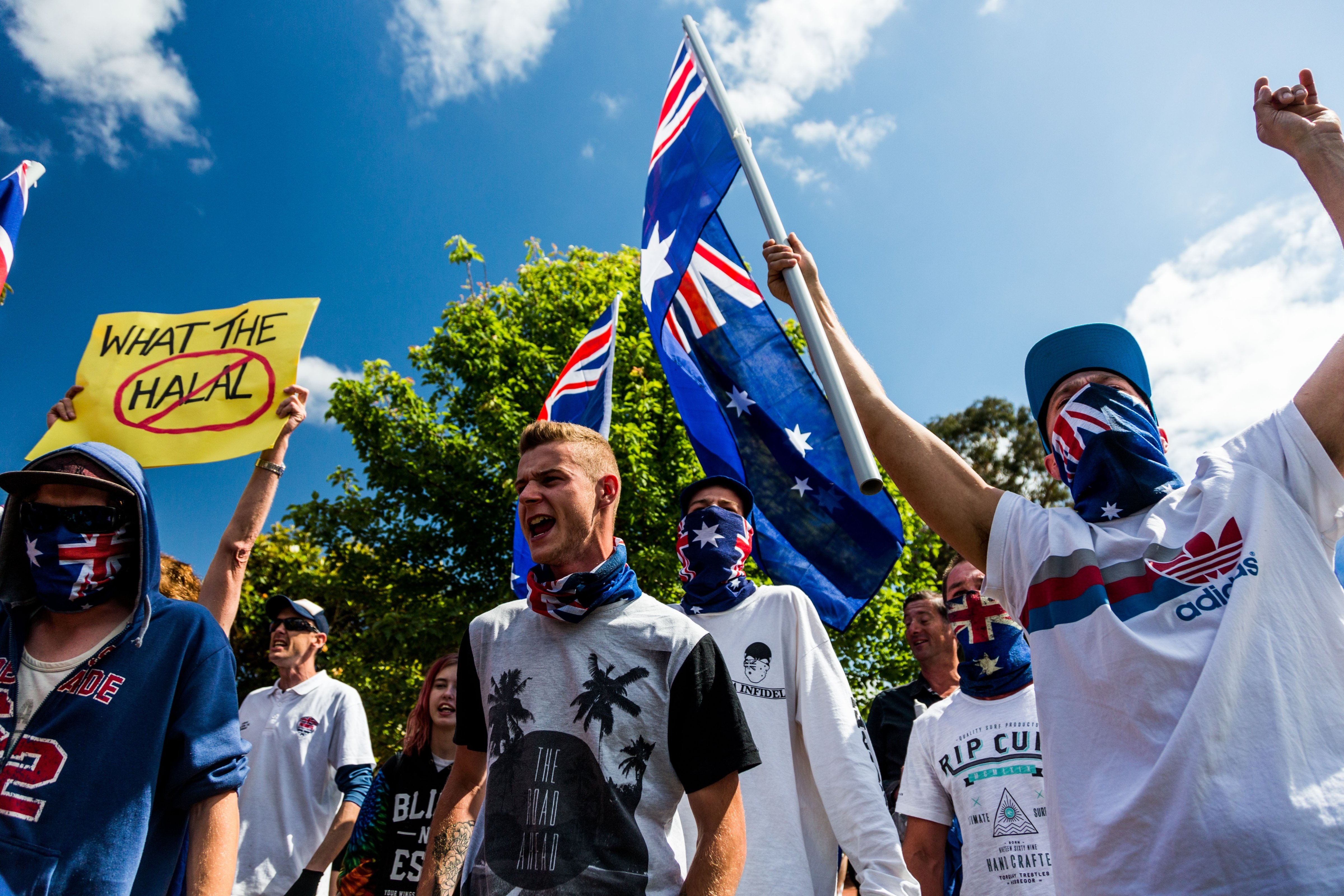 Supporters of the Reclaim Australia group march down the street waving flags and shouting anti-Islamic slogans during a protest in Melbourne on Nov. 22, 2015 (Anadolu Agency—Getty Images)