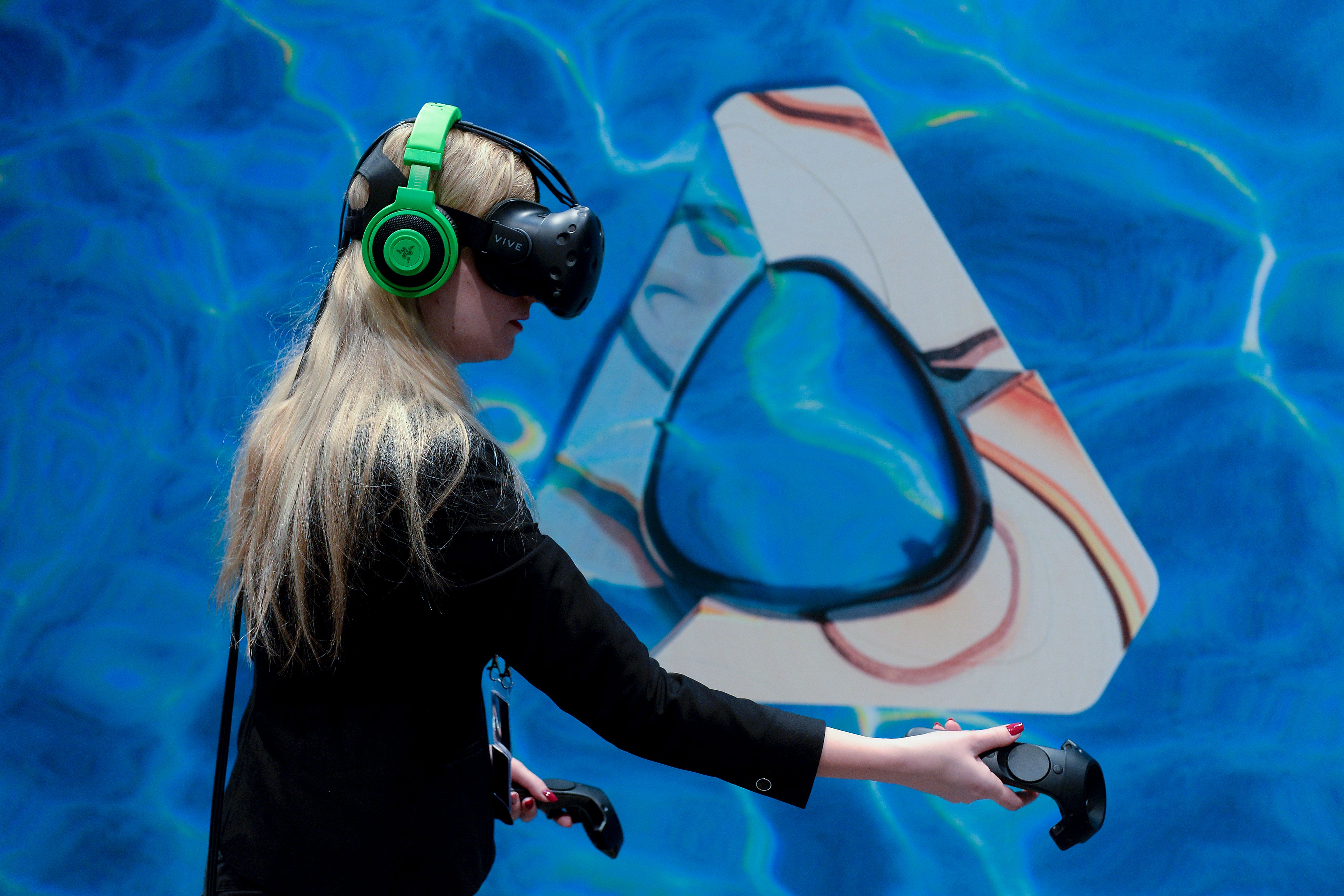 A visitor tests the new 'Vive steam VR' virtual device at the HTC stand on the second day of the Mobile World Congress in Barcelona on February 23, 2016. (Josep Lago&mdash;AFP/Getty Images)