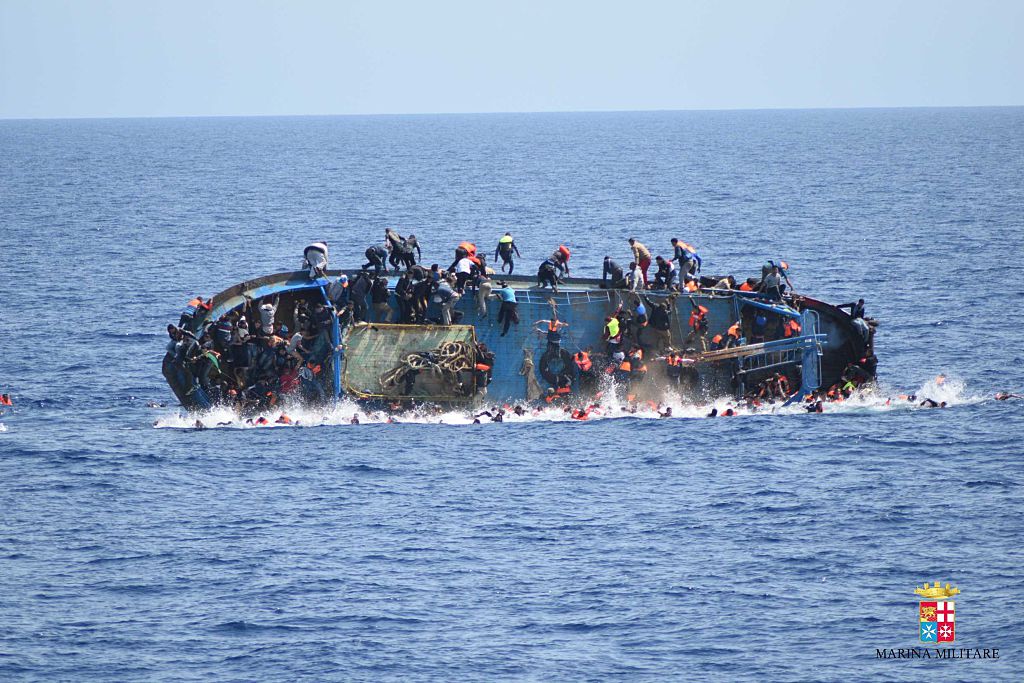 SICILIAN STRAIT, MEDITERRANEAN SEA - MAY 25: Migrants in an overcrowded boat, which was about to capsize, are rescued by Bettica and Bergamini ships of Italian Navy at Sicilian Strait, between Libya and Italy, in Mediterranean sea on May 25, 2016. The Italian Navy saved around 500 migrants as they found dead bodies of seven migrants in the sea during the operations. (Photo by Italian Navy / Marina Militare/Anadolu Agency/Getty Images) (Anadolu Agency&mdash;Getty Images)