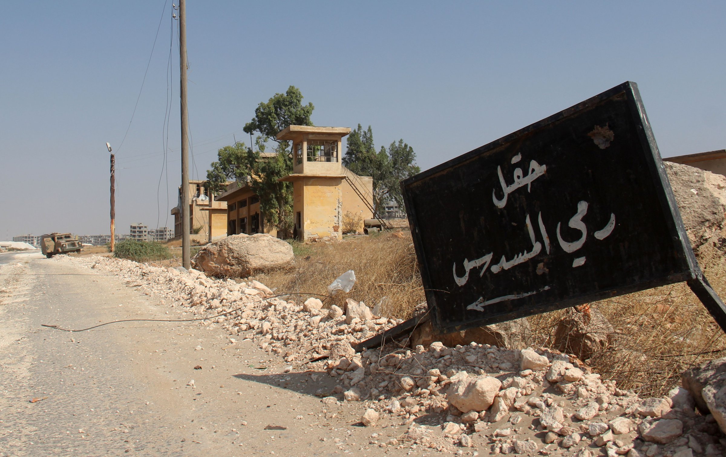 A sign reading in Arabic, "Shooting Range," is seen at a military academy south of Aleppo, Syria, after the former Nusra Front — renamed Jabhat Fateh al-Sham after breaking from al-Qaeda — announced they seized control of two military academies and a third military position, the Syrian Observatory for Human Rights said on Aug. 6, 2016.