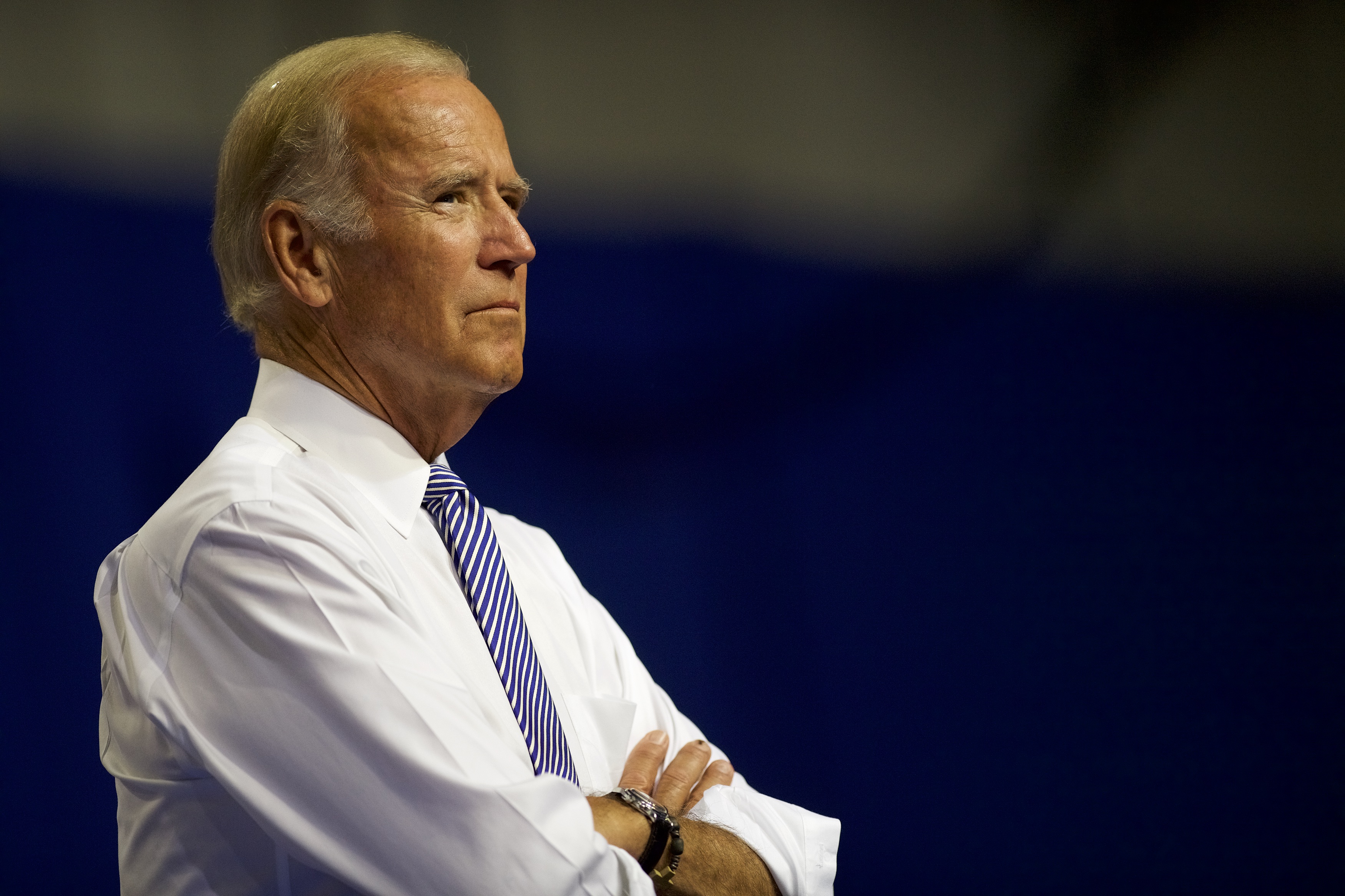 U.S. Vice President Joe Biden listens as Democratic Presidential candidate Hillary Clinton delivers remarks at Riverfront Sports athletic facility on August 15, 2016 in Scranton, Pennsylvania. (Mark Makela—Getty Images)