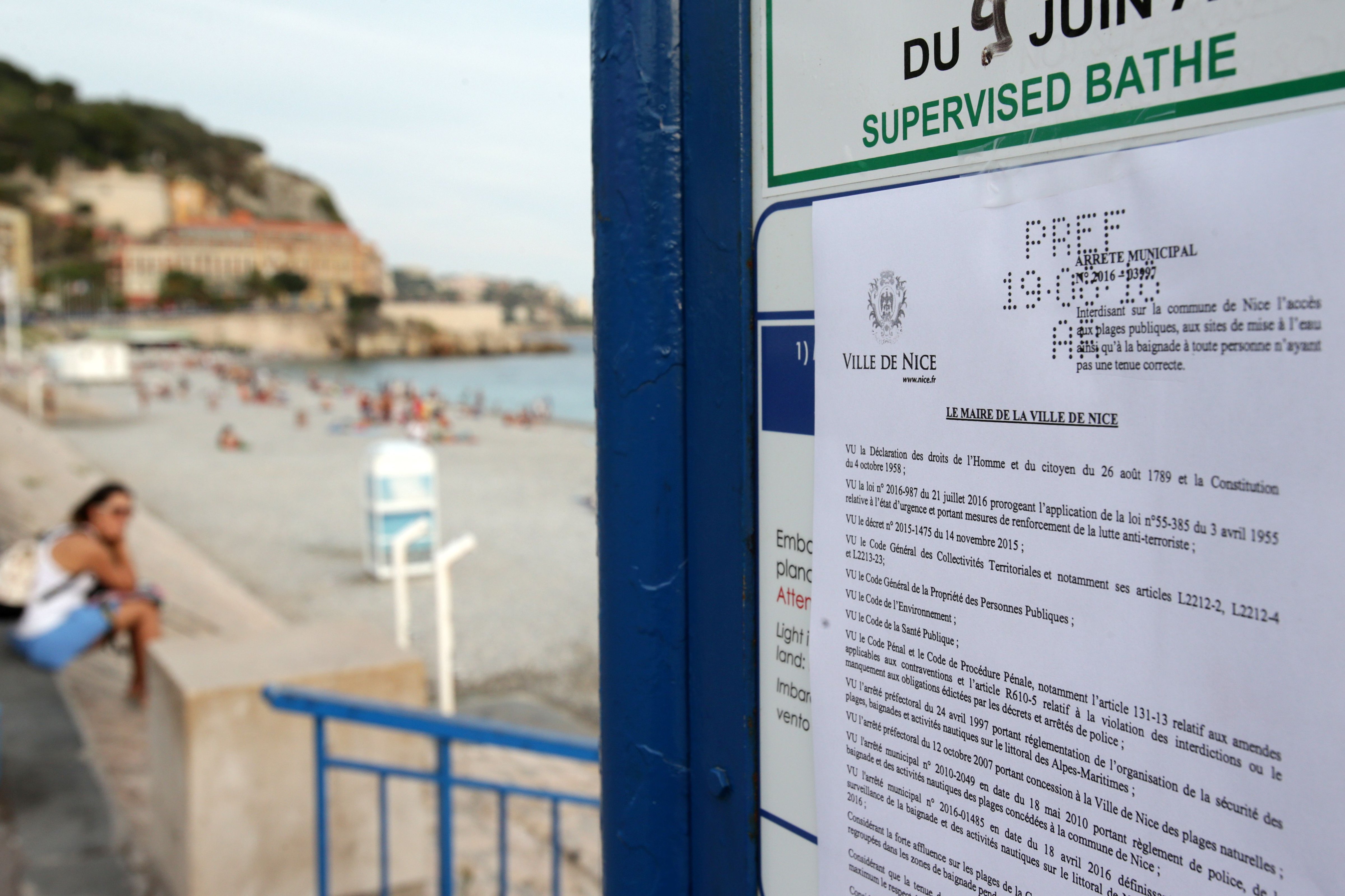 A sign showing the bylaw forbidding women to wear Burkini at the beach in Nice, southeastern France on Aug. 19, 2016. (Jean Christophe Magnenet—AFP/Getty Images)