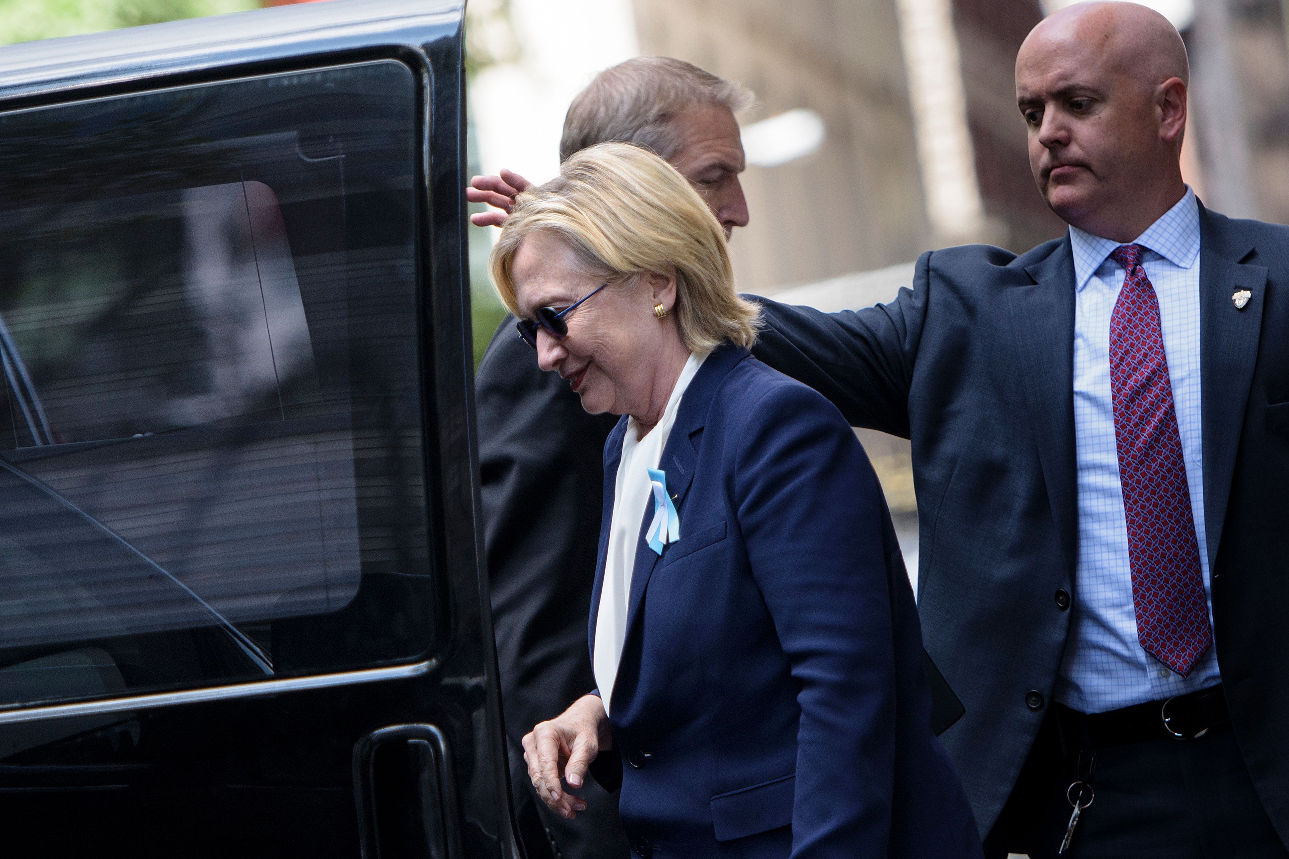 U.S. Democratic presidential nominee Hillary Clinton gets in her car while leaving her daughter's apartment building after resting  on Sept. 11, 2016, in New York. (Brendan Smialowski—AFP/Getty Images)