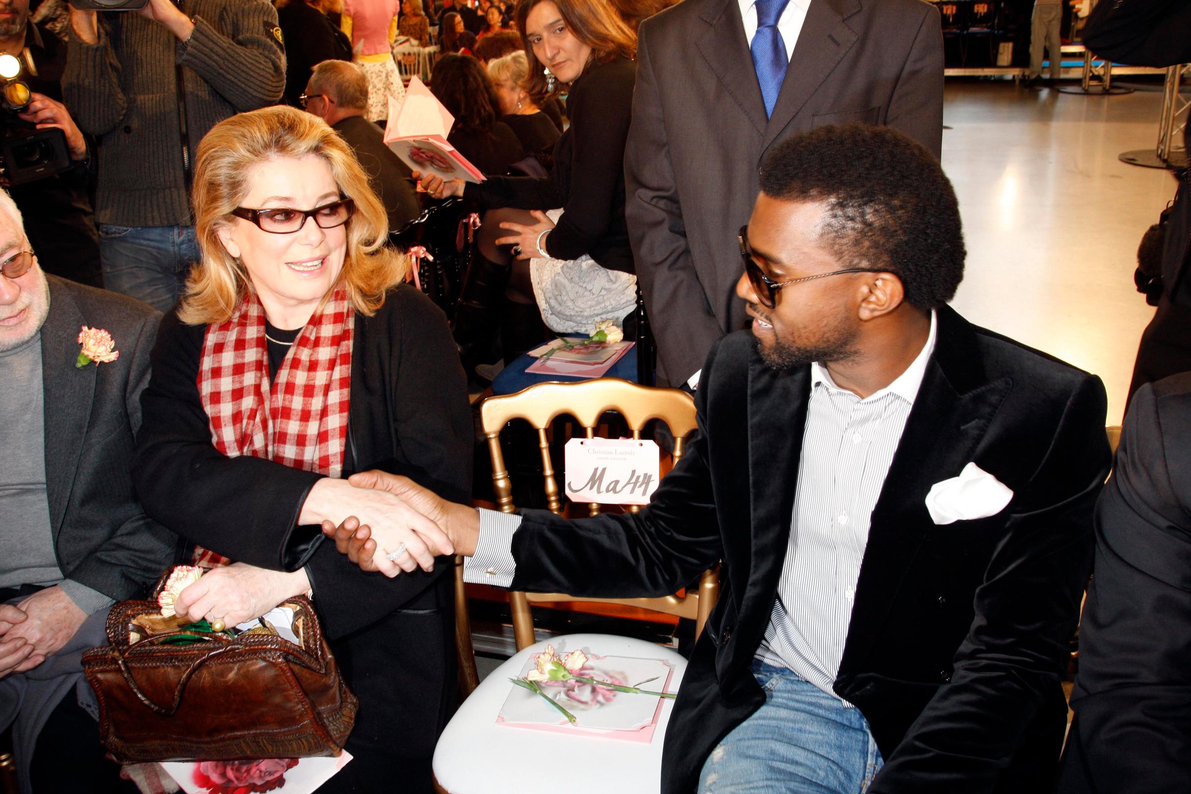 Catherine Deneuve and Kanye West at the Christian Lacroix Spring 2009 couture show.