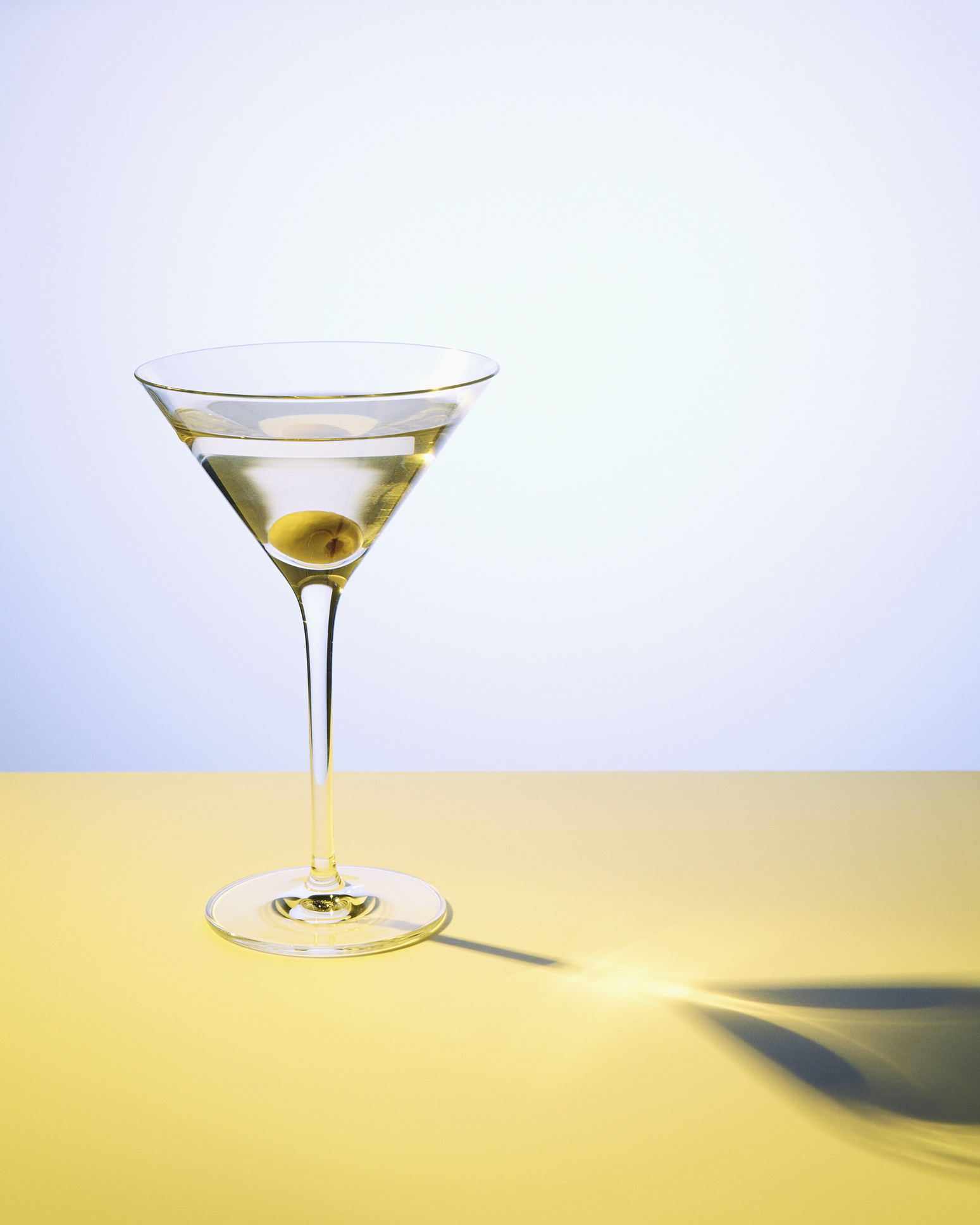 Martini in martini glass with olive