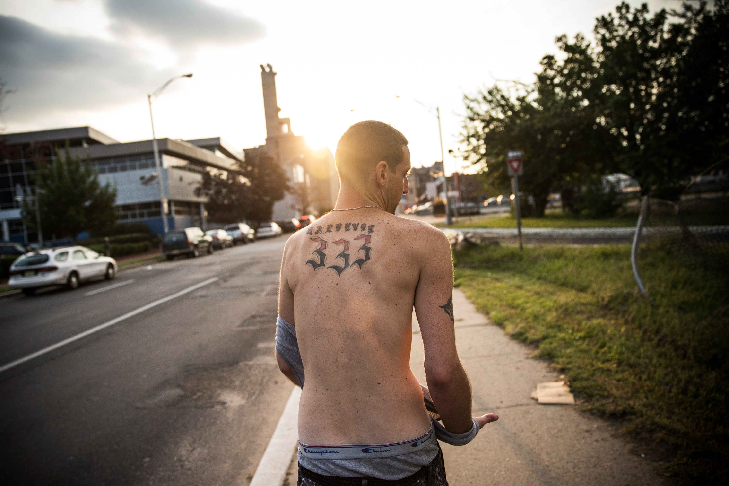 Reggy Colby, age 30 and a recovering heroin addict, walks down the street, on Aug. 21, 2013 in Camden, NJ. (Andrew Burton—Getty Images)