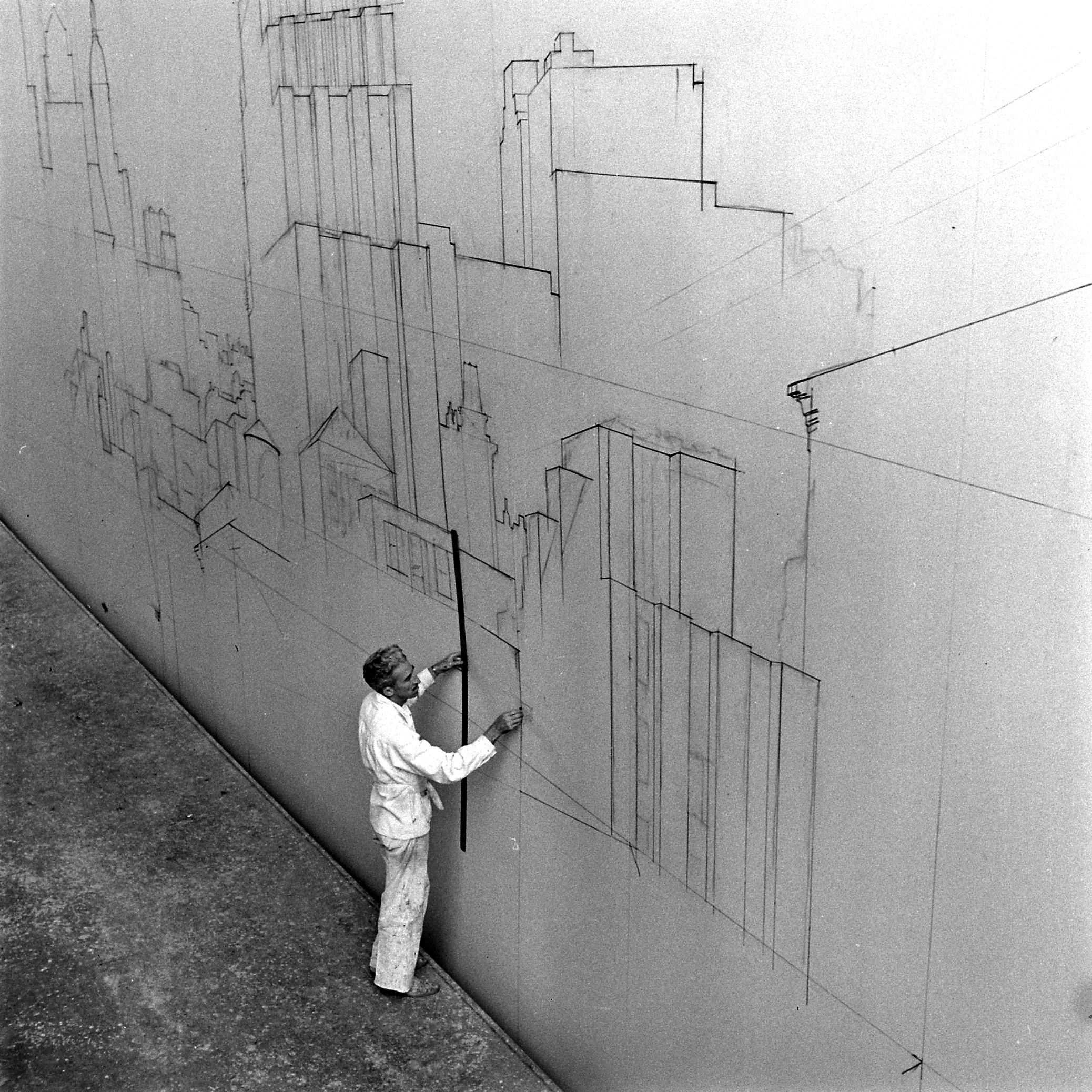 Ben Carre working on the early stages of a backing at the MGM scenic art department in 1942.