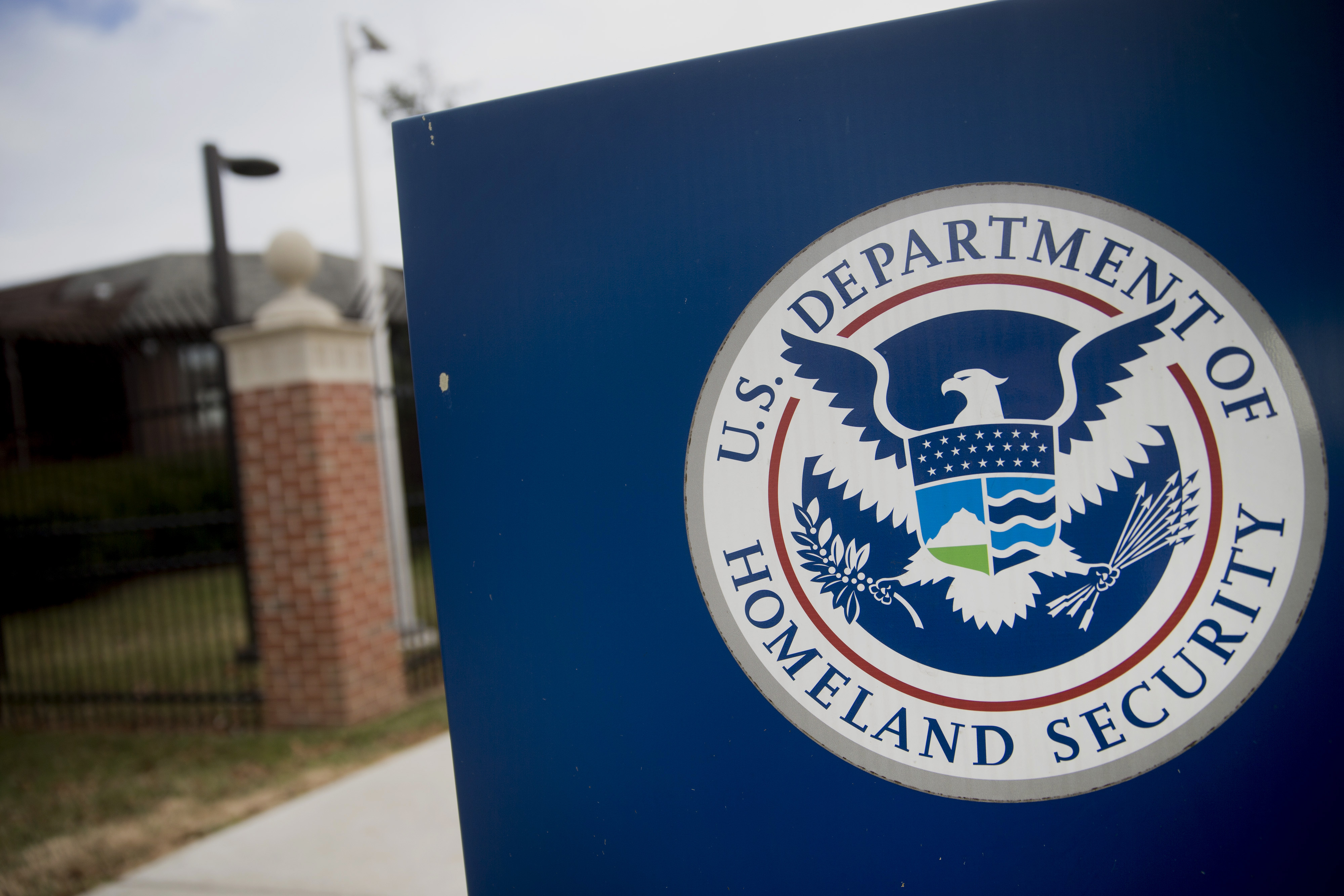 The U.S. Department of Homeland Security (DHS) seal stands at the agency's headquarters in Washington, D.C., U.S., on Thursday, Dec. 11, 2014. The U.S. House is set to pass a $1.1 trillion spending bill that includes a banking provision opposed by many Democrats as a giveaway to large institutions. Current funding for the government ends today, and the measure would finance most of the government through September 2015. The DHS, responsible for immigration policy, would be financed only through Feb. 27. Photographer: Andrew Harrer/Bloomberg via Getty Images (Bloomberg—Bloomberg via Getty Images)