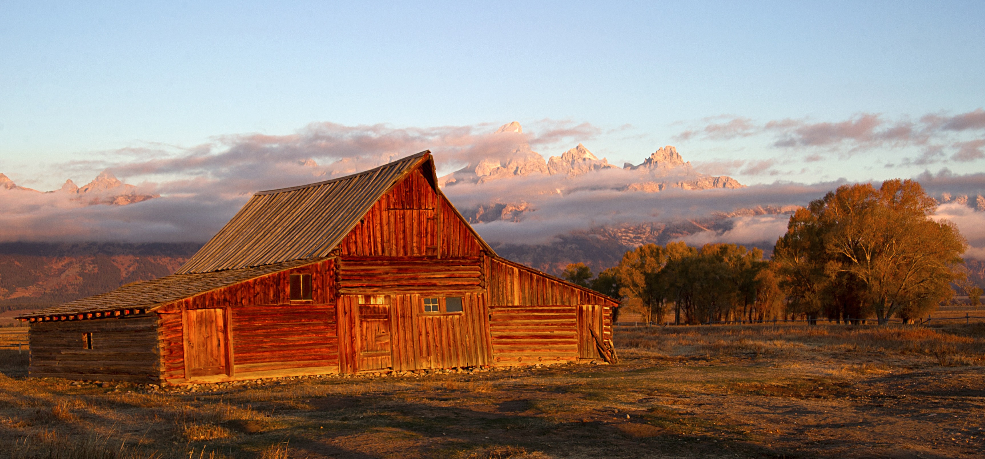 The sun hits the tips of the Grand Tetons behind the Moulton barn October 5, 2012 in the Grand Teton National Park in Wyoming. Grand Teton National Park is located in northwestern Wyoming. Approximately 310,000 acres (130,000 ha) in size, the park includes the major peaks of the 40-mile (64 km) long Teton Range as well as most of the northern sections of the valley known as Jackson Hole. AFP PHOTO/Karen BLEIER        (Photo credit should read KAREN BLEIER/AFP/Getty Images) (Karen Bleier—Getty Images)