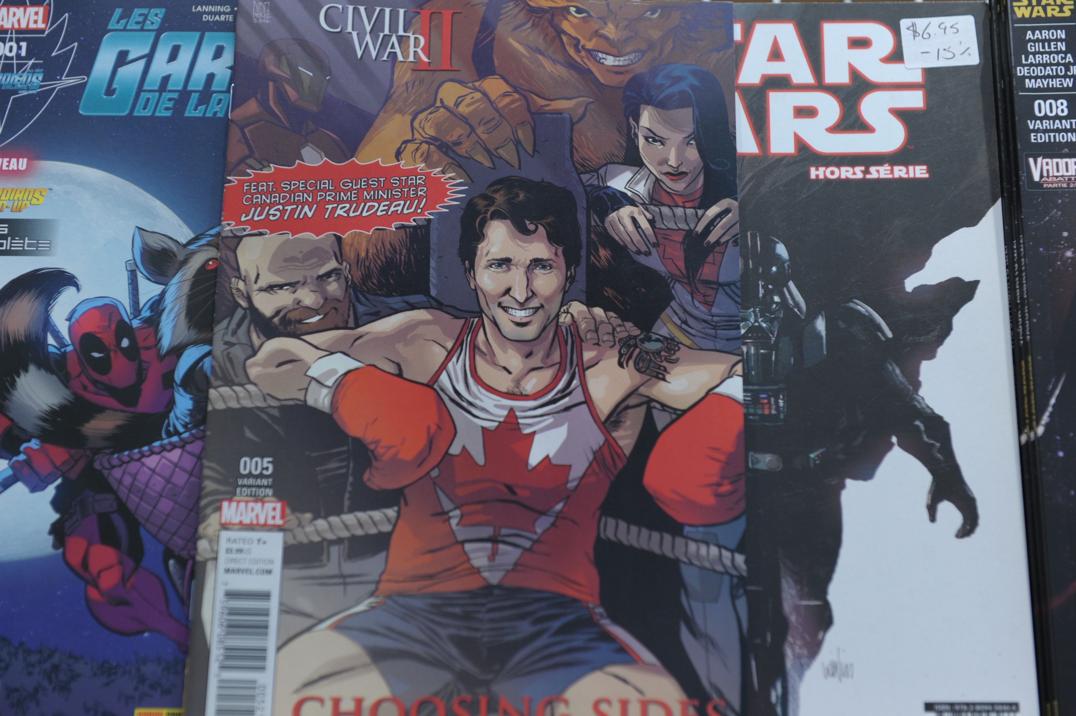 The cover of US publisher Marvel's comic book, featuring Canadian Prime Minister Justin Trudeau as a super hero in front of a newstand in Montreal, Canada on Aug. 31, 2016. 
                      
                      Canadian Prime Minister Justin Trudeau takes the role of a superhero in a comic book by US publisher Marvel released on newsstands August 31 in Canada. Trudeau appears smiling in a corner of a boxing ring on the cover of the comic book, a limited edition in English of the series "Civil War II: Choosing Sides" wearing a maple leaf shirt.  / AFP / Marc BRAIBANT / TO GO WITH AFP STORY BY MARC BRAIBANT        (Photo credit should read MARC BRAIBANT/AFP/Getty Images) (MARC BRAIBANT—AFP/Getty Images)