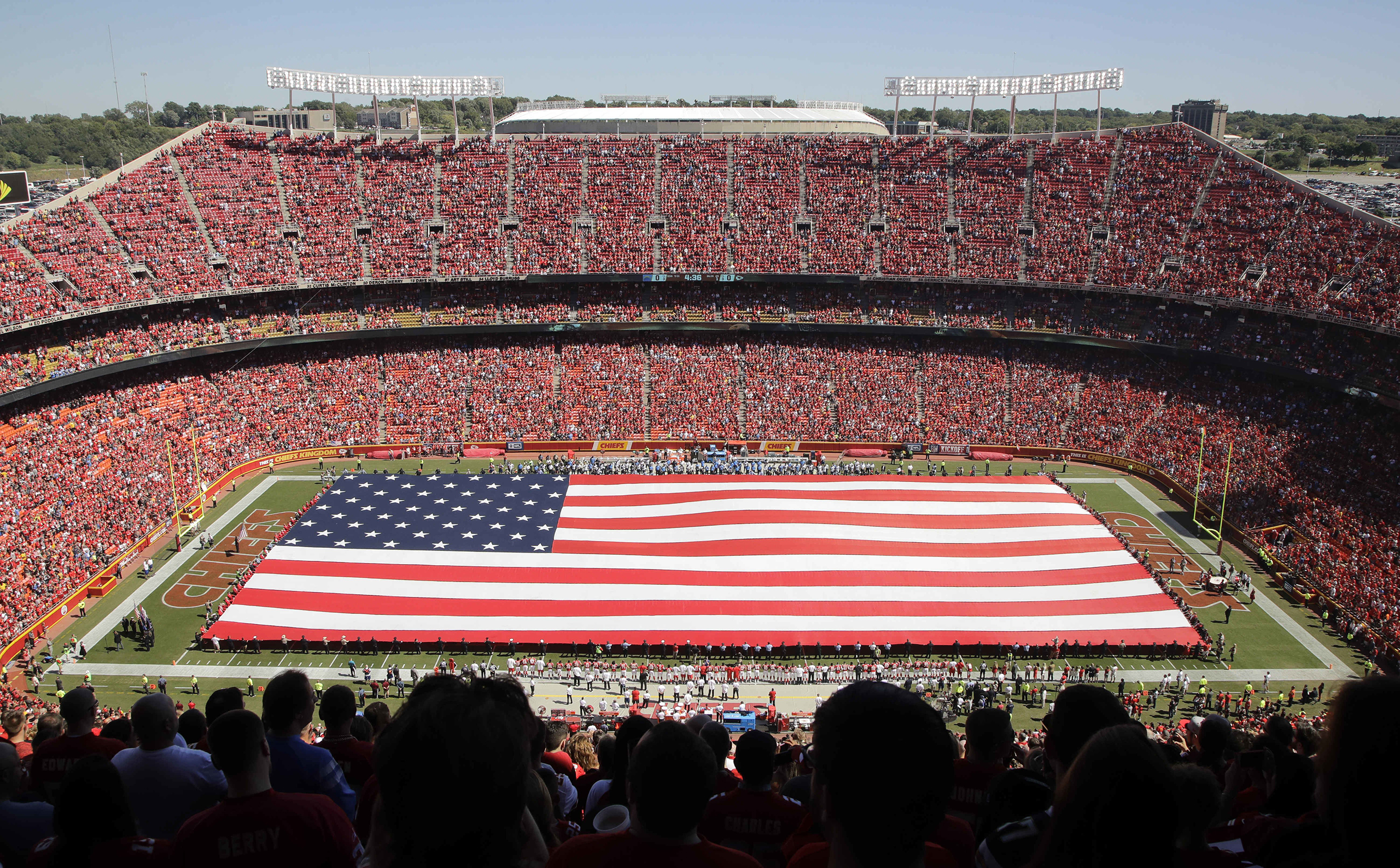 A giant flag is spread over the field at Arrowhead Stadium to commemorate Sept. 11, before an NFL football game between the Kansas City Chiefs and the San Diego Chargers in Kansas City, Missouri, Sept. 11, 2016. (Charlie Riedel—AP)