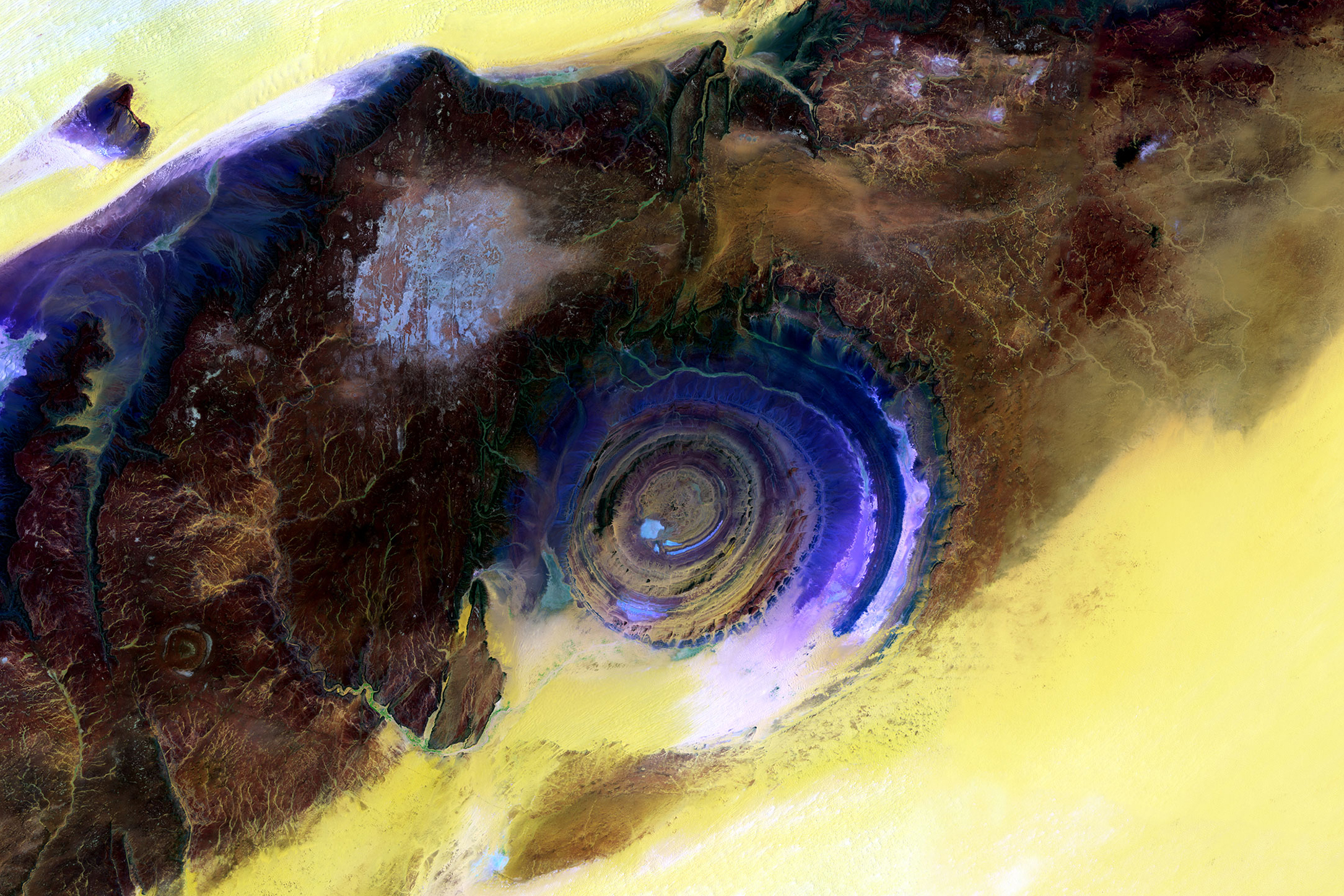 Eye of the Sahara, Mauritania
                              Scientists blended visible and infrared wavelengths to enhance the visibility of the different rock layers of this spectacular rock formation on the western edge of the Sahara desert. June 28 and July 5, 2015.