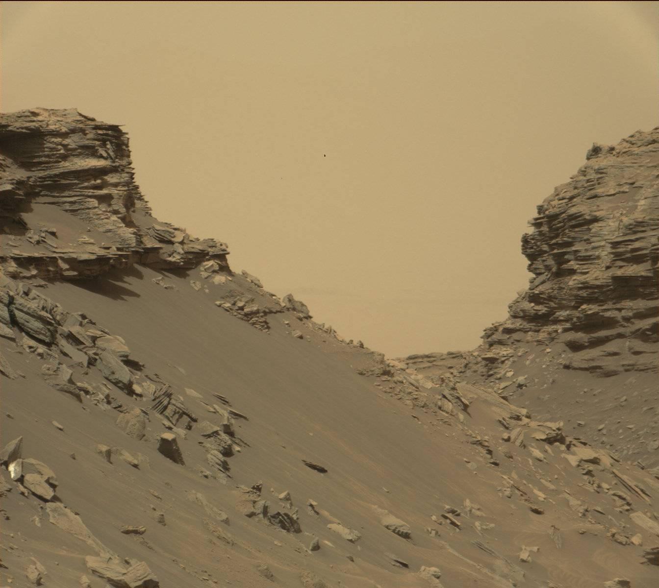 Curiosity viewed sloping buttes and layered outcrops as it exited the  Murray Buttes  region on lower Mount Sharp, Sept. 9, 2016.