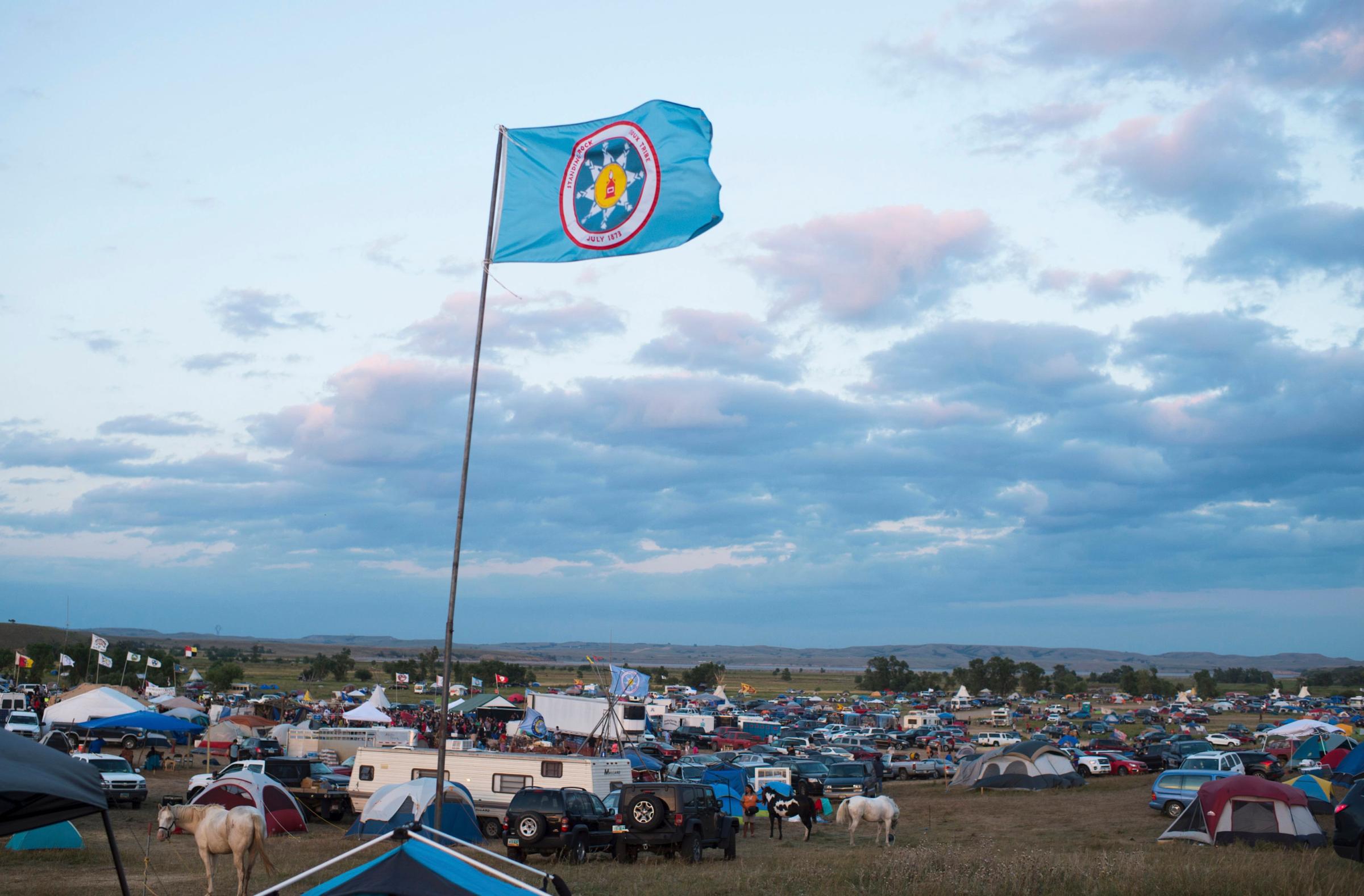 A Standing Rock Sioux flag flies over a protest encampment near Cannon Ball, North Dakota on Sept. 3, 2016.