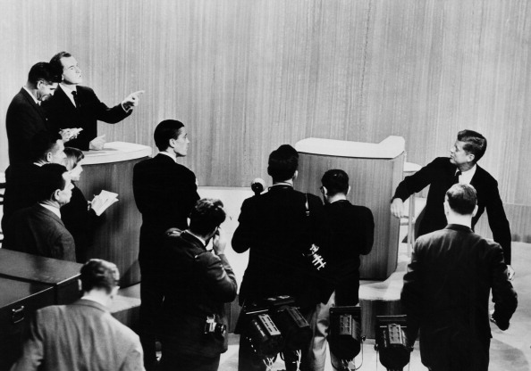 US Vice President and Republican presidential candidate Richard Nixon (1913 - 1994) (left) talks and points at US Senator and Democratic presidential candidate John F. Kennedy (1917 - 1963) (far right) as he walks away from the podium at their fourth televised presidential debate, ABC Studios, New York, New York, October 21, 1960.