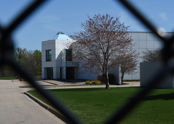 The entrance of the Paisley Park compound of music legend Prince is seen through a fence in Minneapolis, Minnesota, on April 22, 2016.