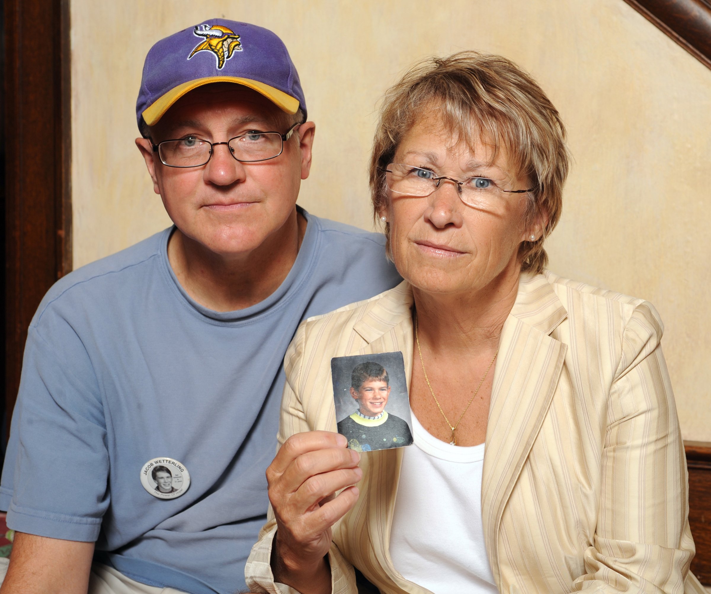 Patty and Jerry Wetterling show a photo of their son Jacob Wetterling, who was abducted in October of 1989 in St. Joseph, Minnesota, Aug. 28, 2009.