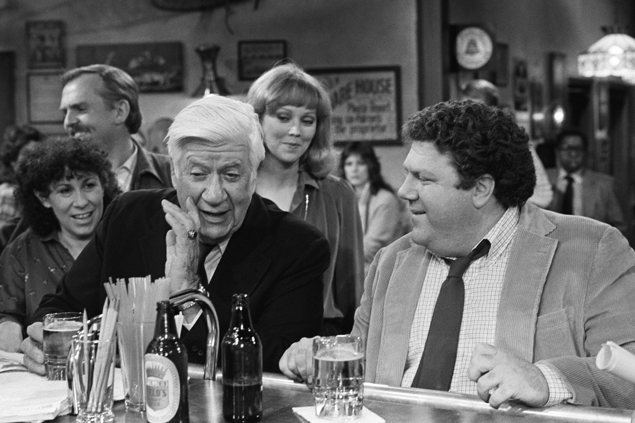 From left: Rhea Perlman, John Ratzenberger, Thomas P. "Tip" O'Neill, Shelley Long, and George Wendt on Cheers, 1983.