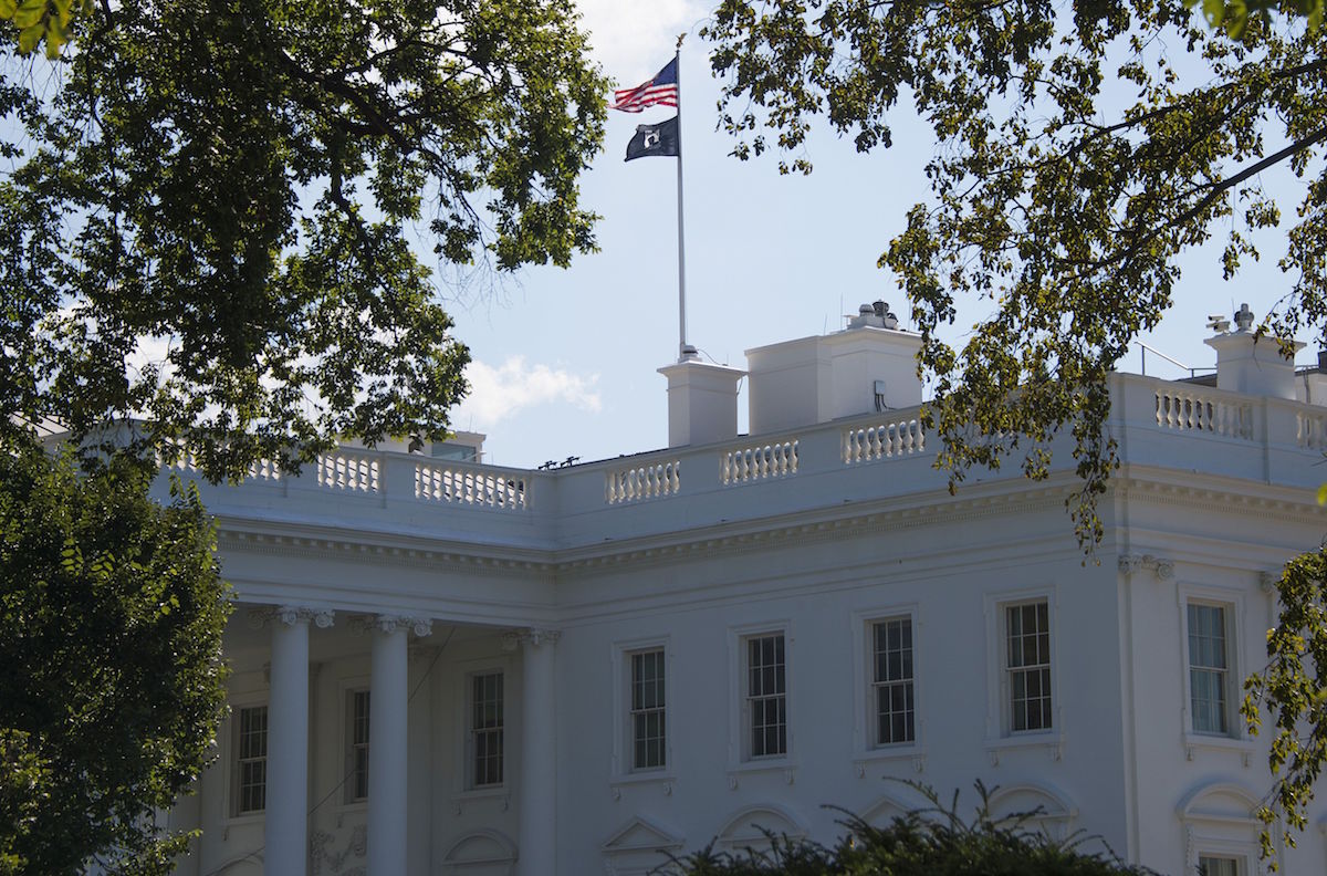 A Prisoners of War/Missing in Action (POW/MIA) flag flies over the White House on Sept. 18, 2015, for National POW/MIA recognition day. (Jim Watson—AFP/Getty Images)