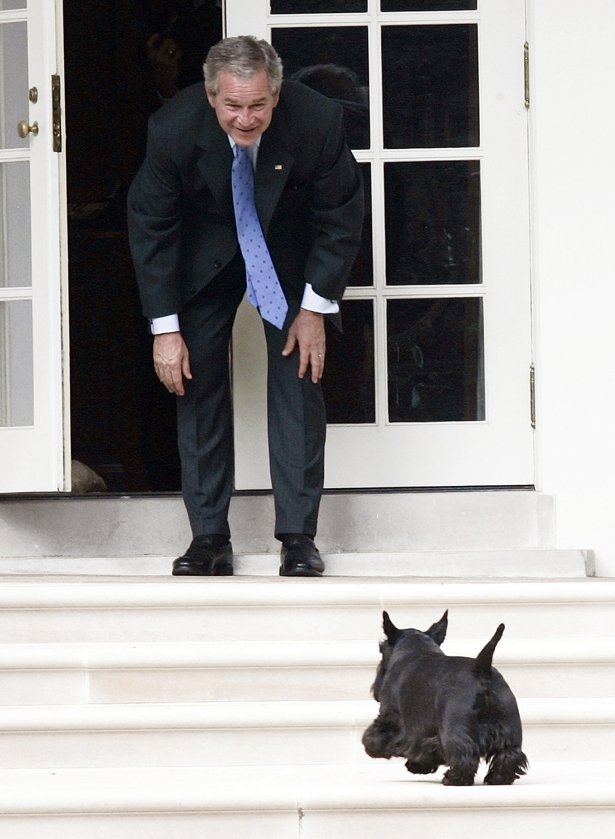 George W. Bush calls for his dog Barney as he stands on the West Wing Colonnade at the White House on Sept. 28, 2007.