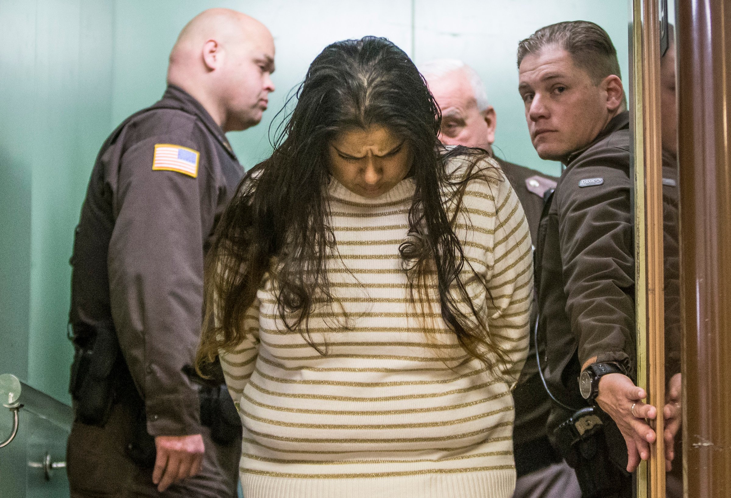 Purvi Patel is taken into custody after being sentenced to 20 years in prison for feticide and neglect of a dependent, at the St. Joseph County Courthouse in South Bend, Indiana, March 30, 2015.