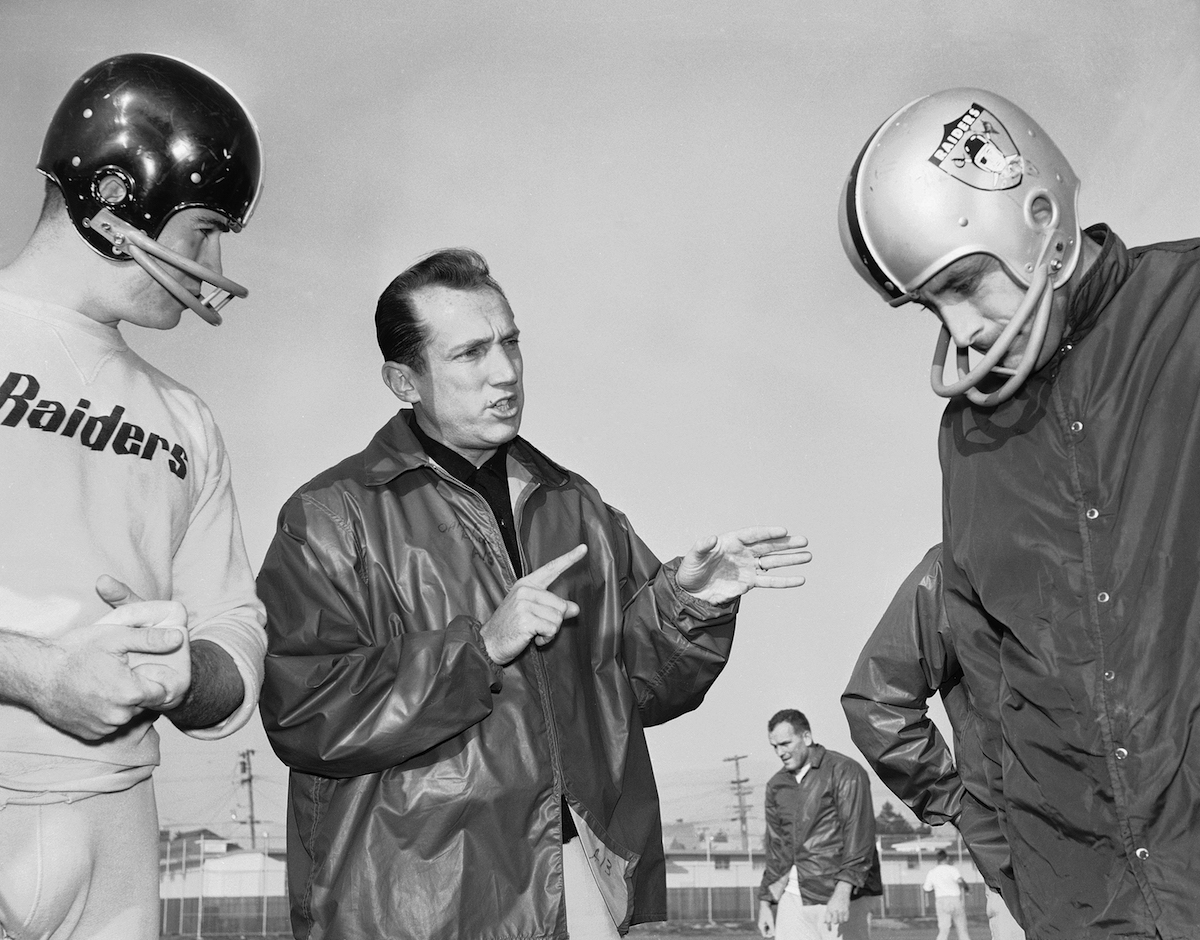 Al Davis, head coach of the American Football League’s Oakland Raiders, is shown as he talked, Dec. 18, 1963 in Oakland with his players at the team’s home practice field. (Robert Klein—AP)