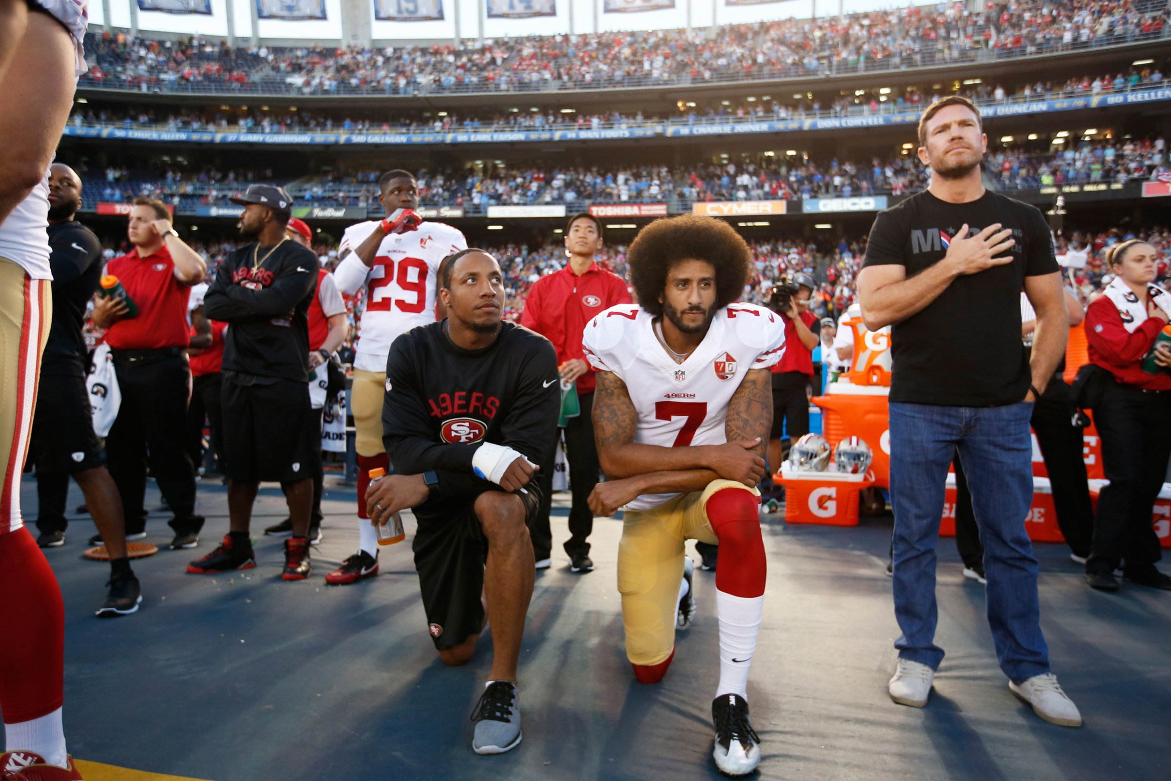 Eric Reid, left, and Colin Kaepernick of the San Francisco 49ers kneel during the national anthem on Sept. 1