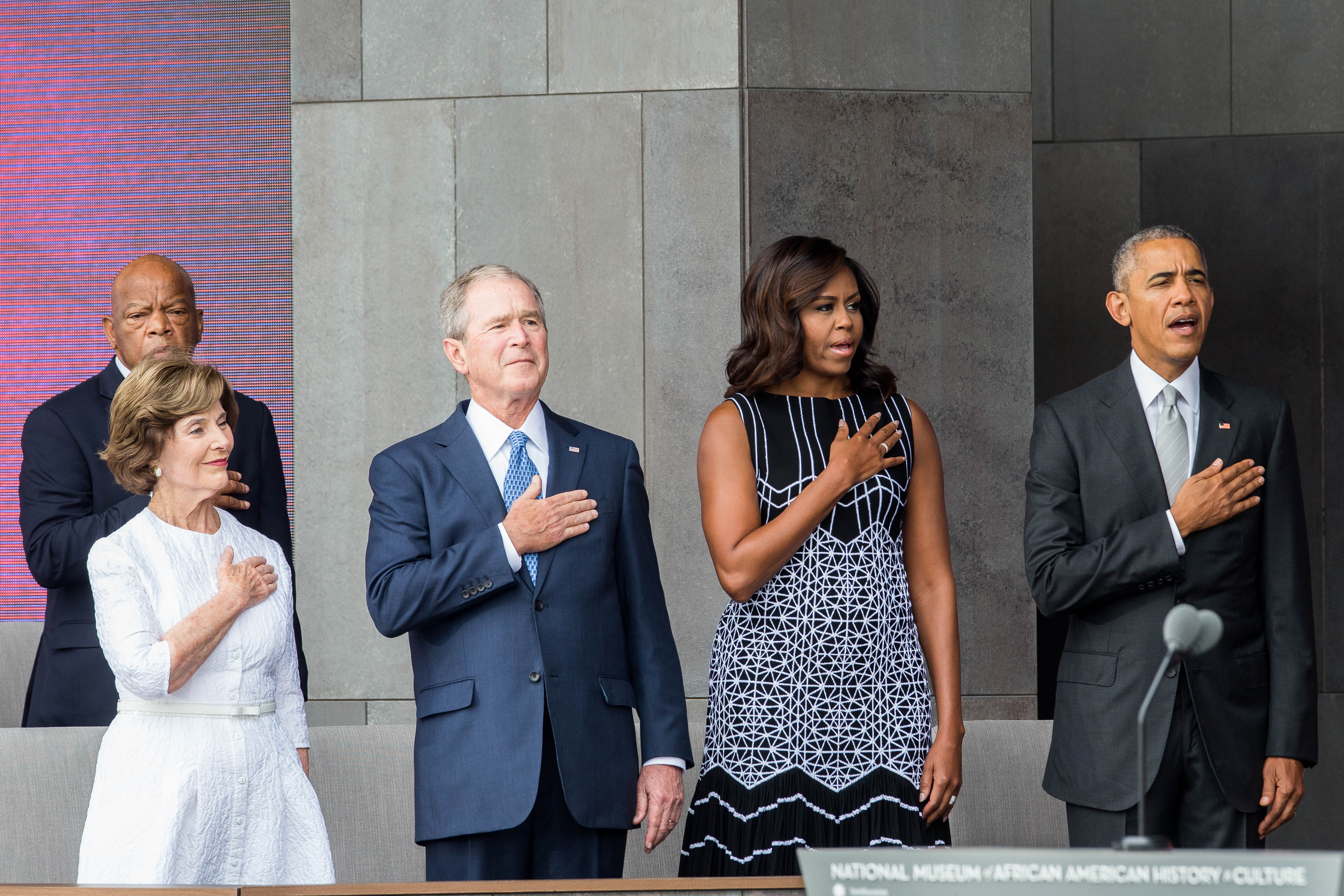 Former First Lady Laura Bush, former President George W. Bush, First Lady Michelle Obama and President Barack Obama stand for the National Anthem during the opening ceremony for the Smithsonian National Museum of African American History and Culture on Sept. 24, 2016 in Washington, D.C. (Zach Gibson—AFP/Getty Images)